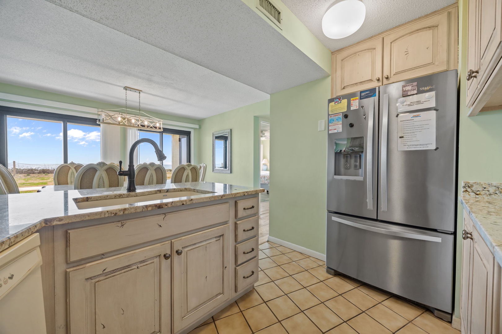 Your fully-equipped kitchen awaits with granite counters, stainless appliances, and stunning views to inspire your culinary adventures.