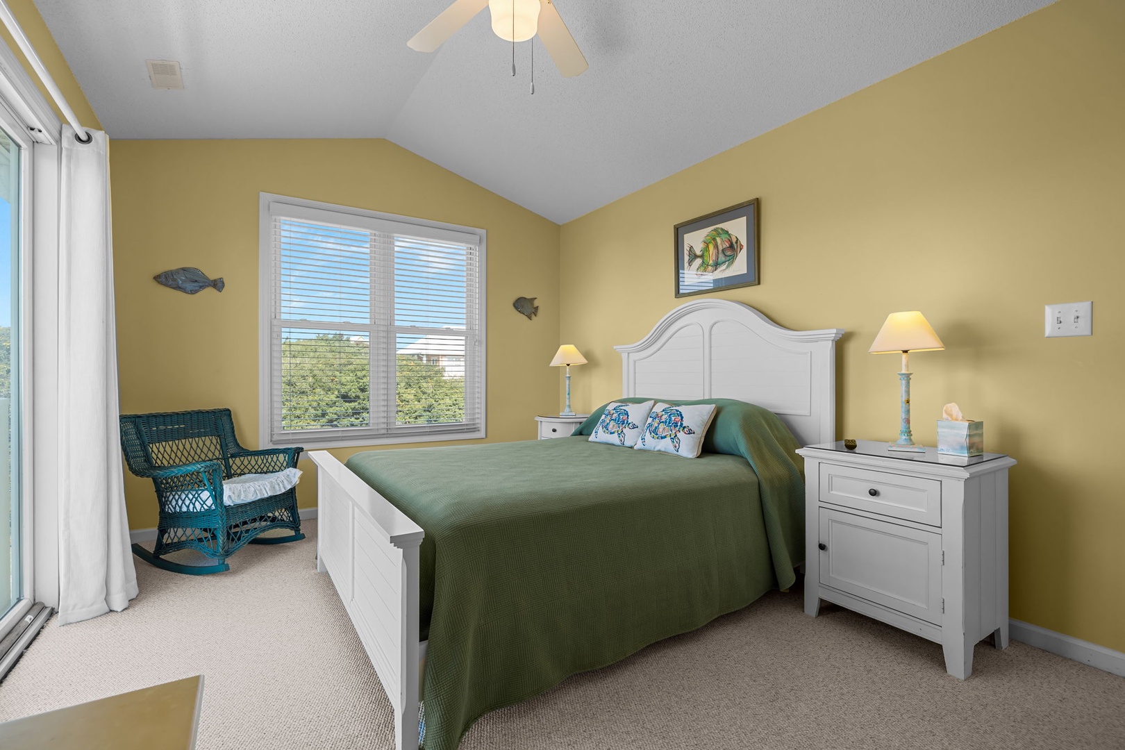 Wake up in your cheerful yellow bedroom with coastal charm, where the ceiling fan keeps you cool and your private reading nook awaits.