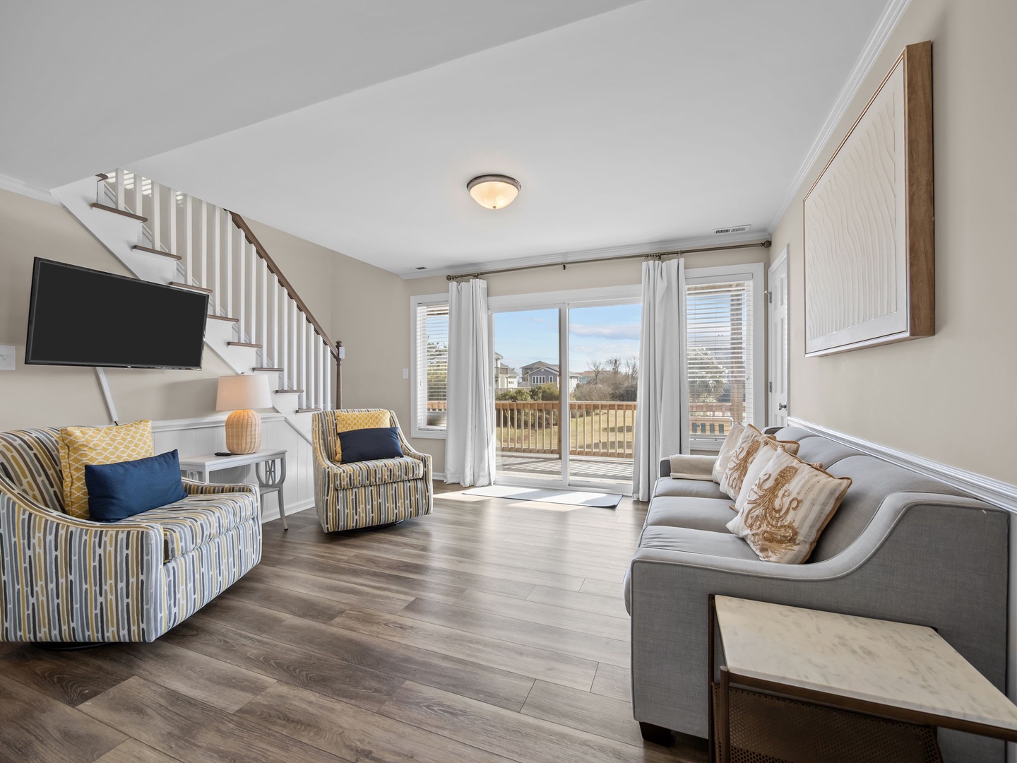 Relax in your bright, airy living space with comfortable seating and sliding doors that open to your private deck.