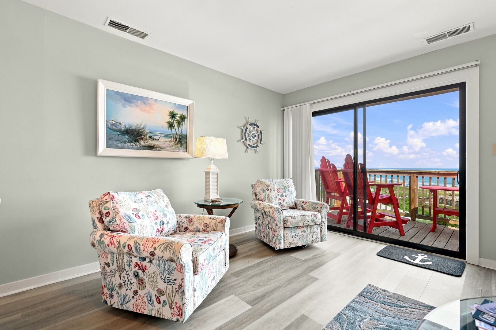 Char’s Cozy Condo | Living Area and Balcony Access