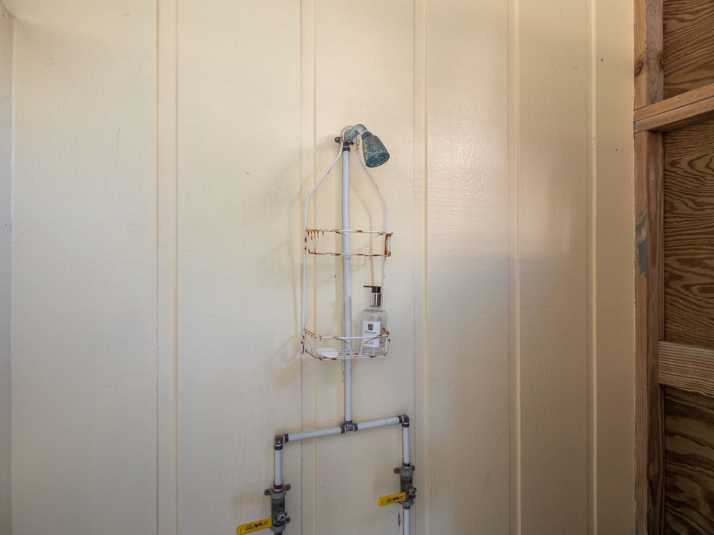 Your private shower features a handheld showerhead and convenient caddy for toiletries.