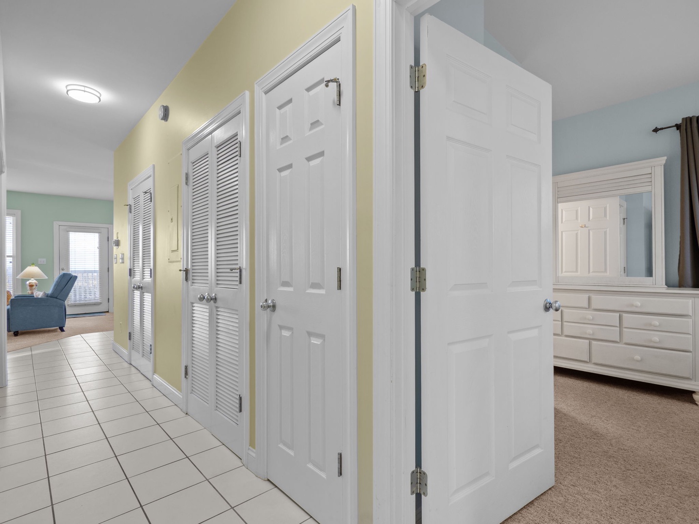Bright hallway connects your living spaces with convenient storage closets and easy access to every room in your home.