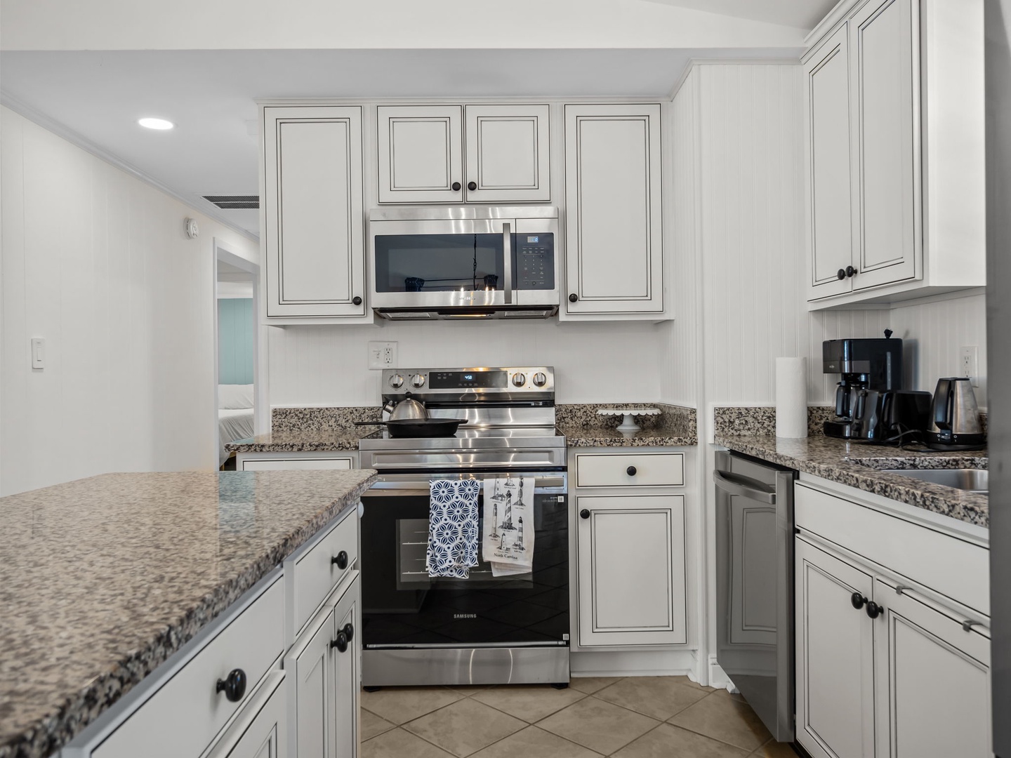 Your fully equipped kitchen awaits with granite countertops, stainless steel appliances, and ample cabinet storage for memorable meal preparations.