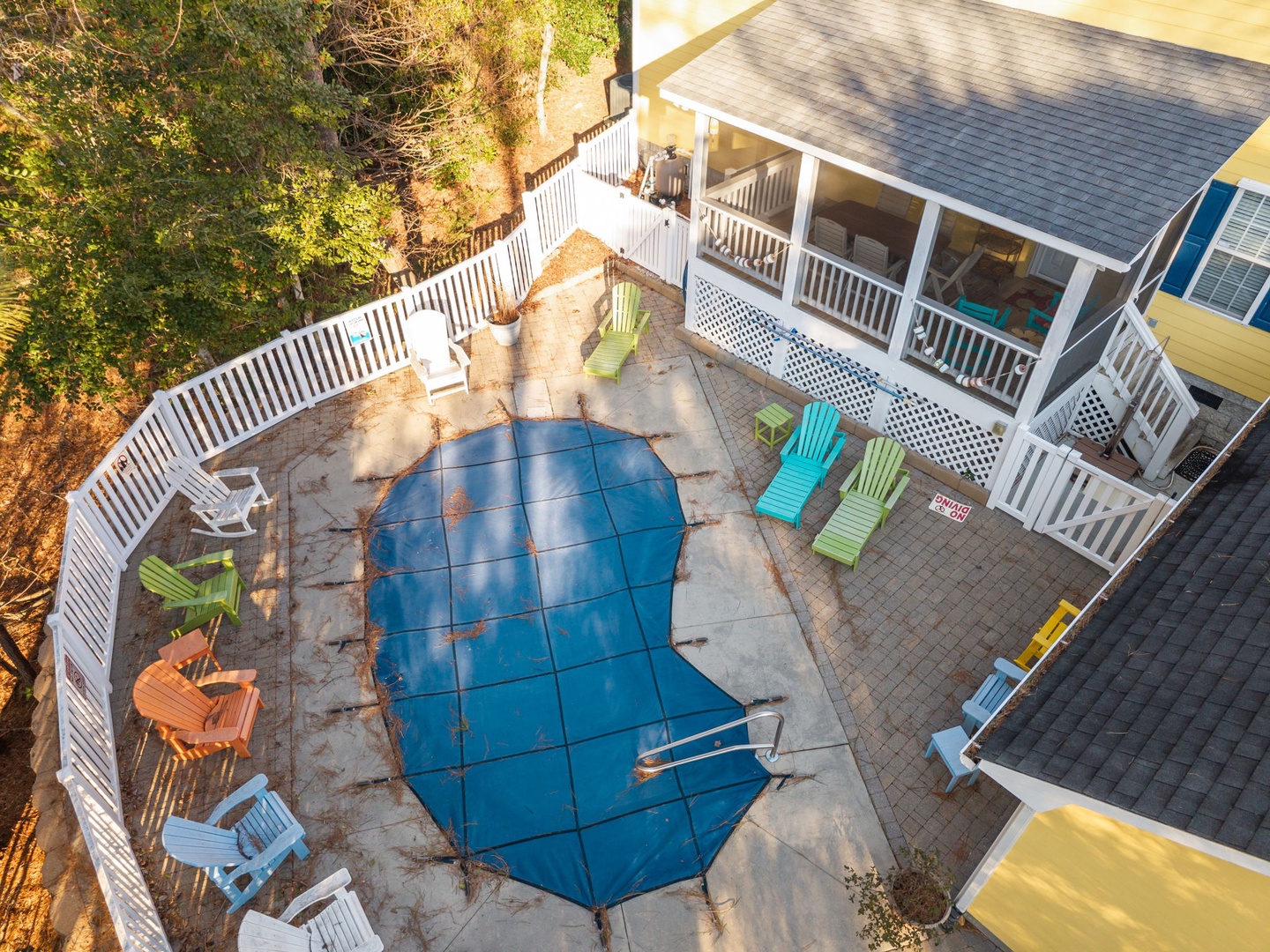 Aerial view showing the vacation rental property with its private swimming pool and covered porch areas.