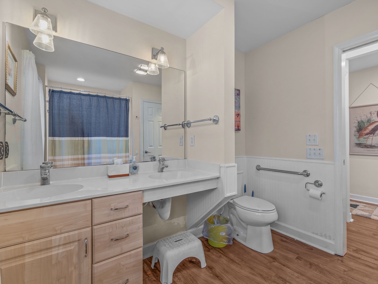 Your spacious bathroom features dual sinks and modern amenities, plus thoughtful accessibility features for everyone's comfort.