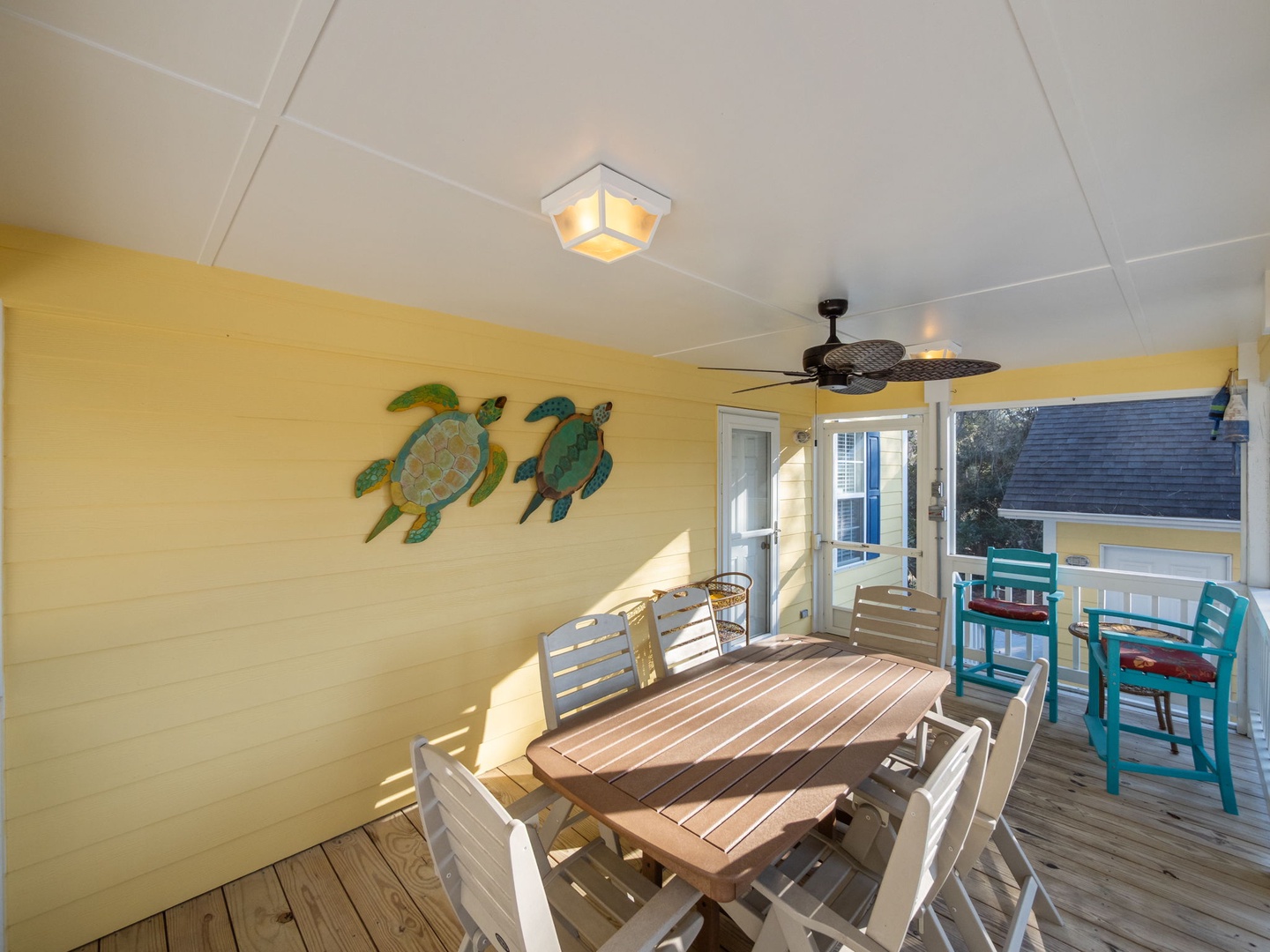 Dine under tropical turtle art on your private deck, where coastal breezes and cheerful colors create the perfect spot for memorable meals.