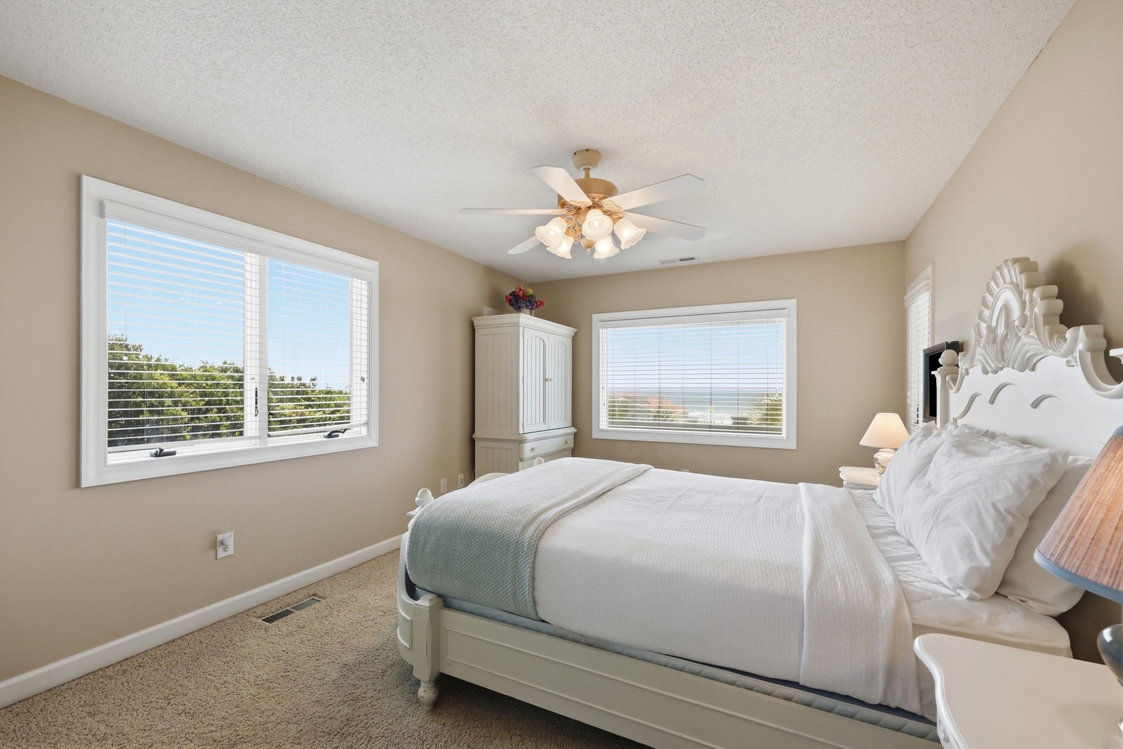 Drift off in a serene bedroom where soft coastal tones and gentle sunlight create your personal sanctuary. Elegant furnishings and crisp linens invite your most restful nights.