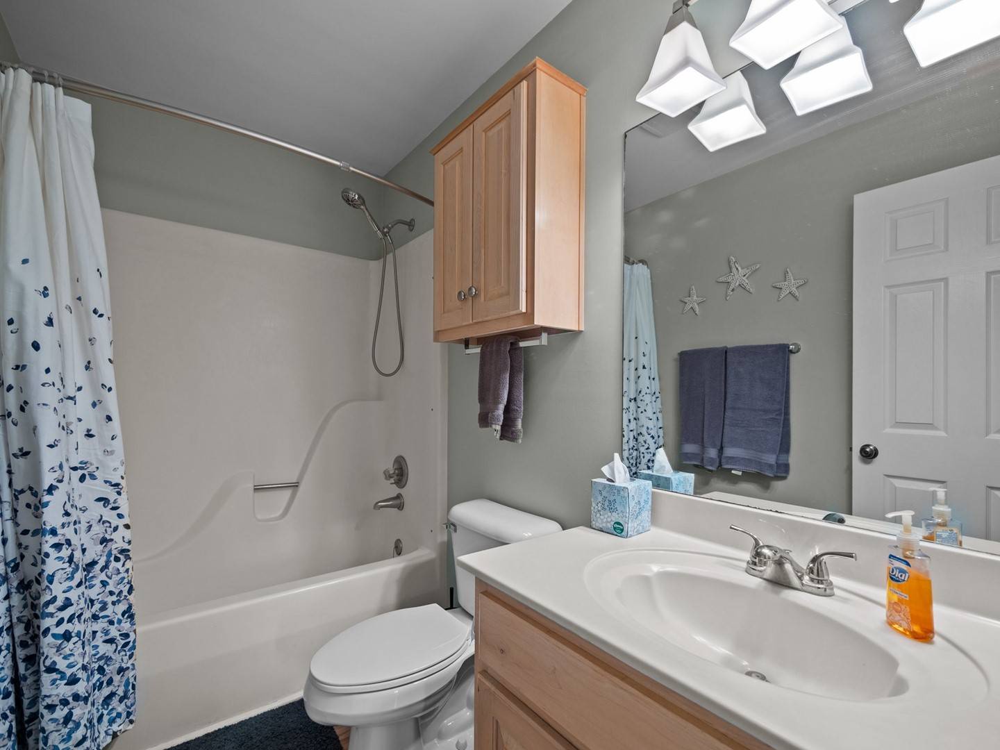 2nd Floor Hallway: Refresh in your bright bathroom with natural skylight, spacious tub-shower combo, and coastal starfish charm.
