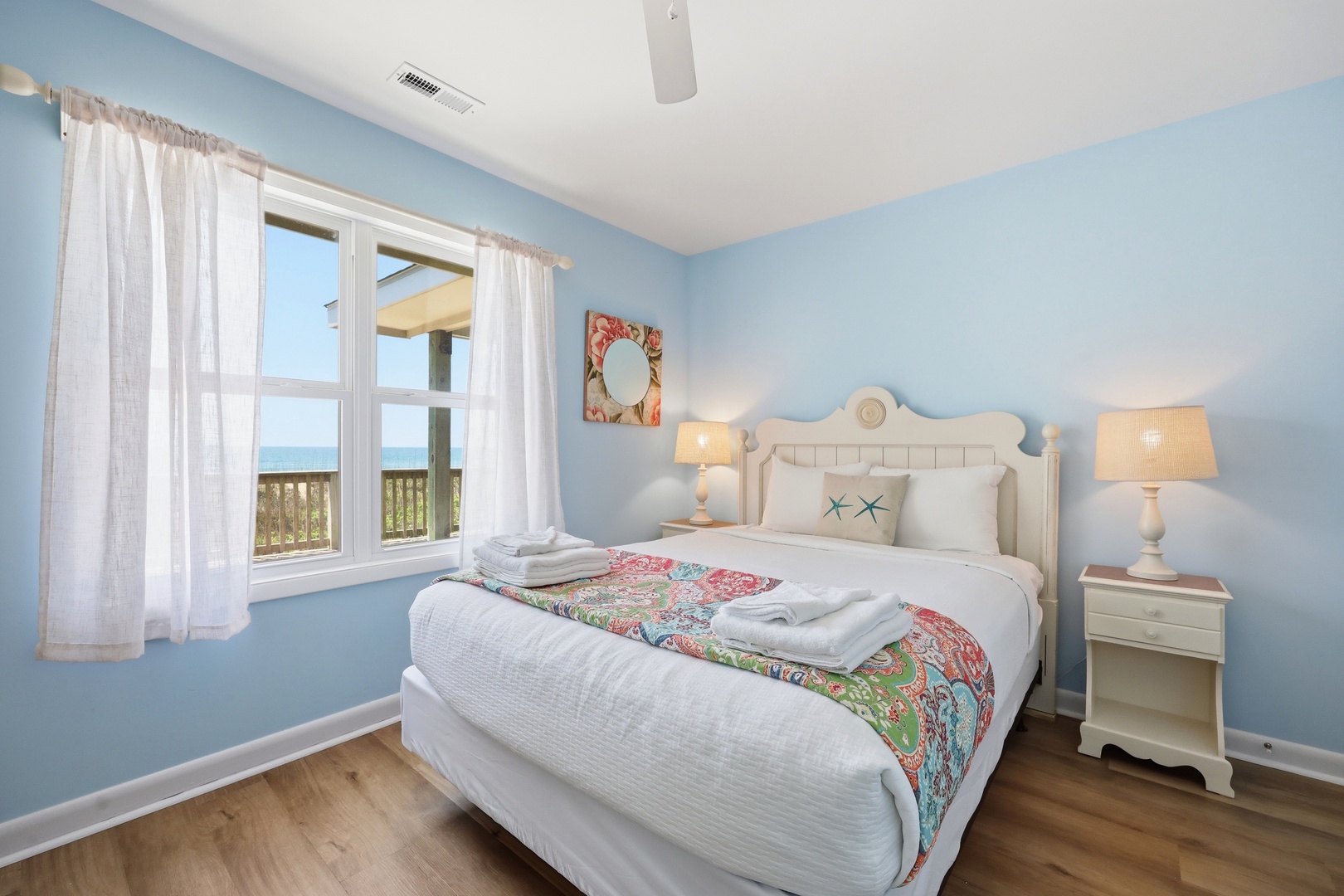 Wake up to stunning ocean views from your serene coastal retreat. Soft blue hues and crisp linens create a calming oasis where you can unwind and recharge by the sea.