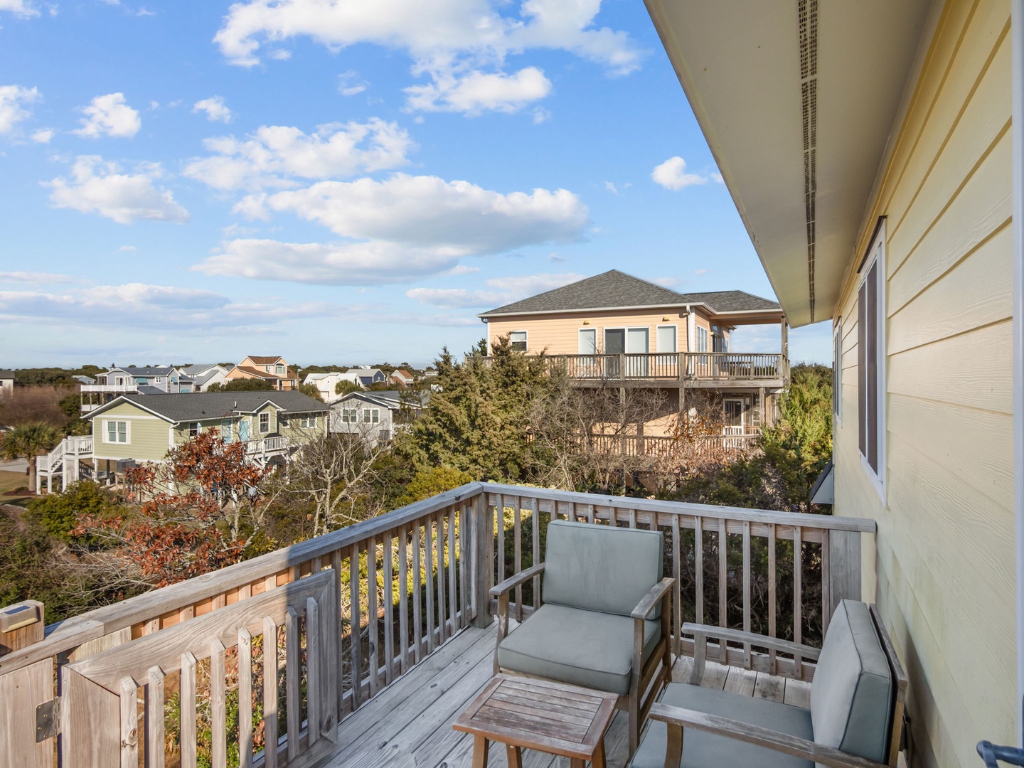 Step onto your private balcony and breathe in fresh coastal air while watching clouds drift across endless blue skies.