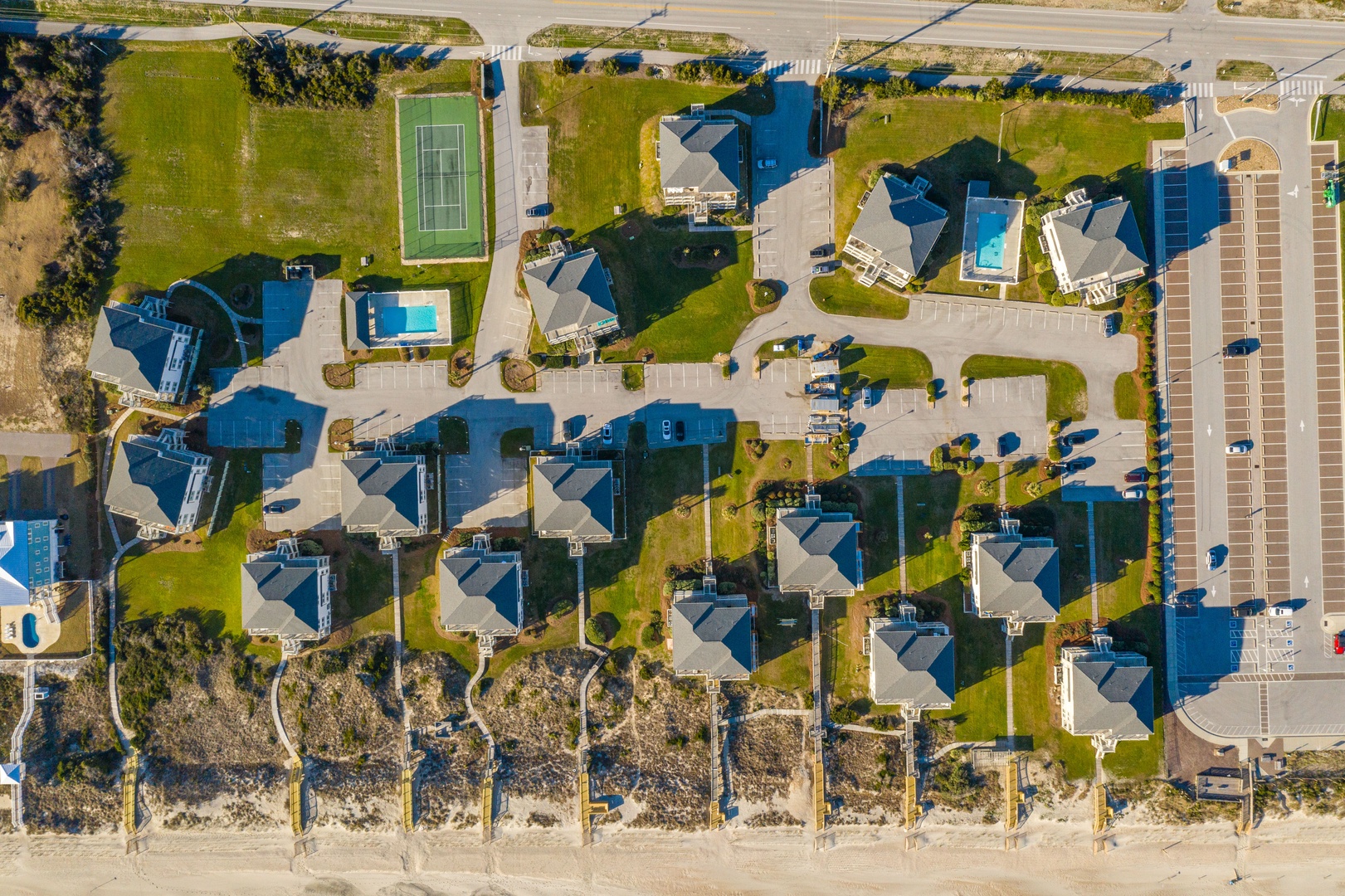 Beachfront resort community featuring spacious vacation homes with pools and sports facilities, perfectly positioned for your coastal getaway.