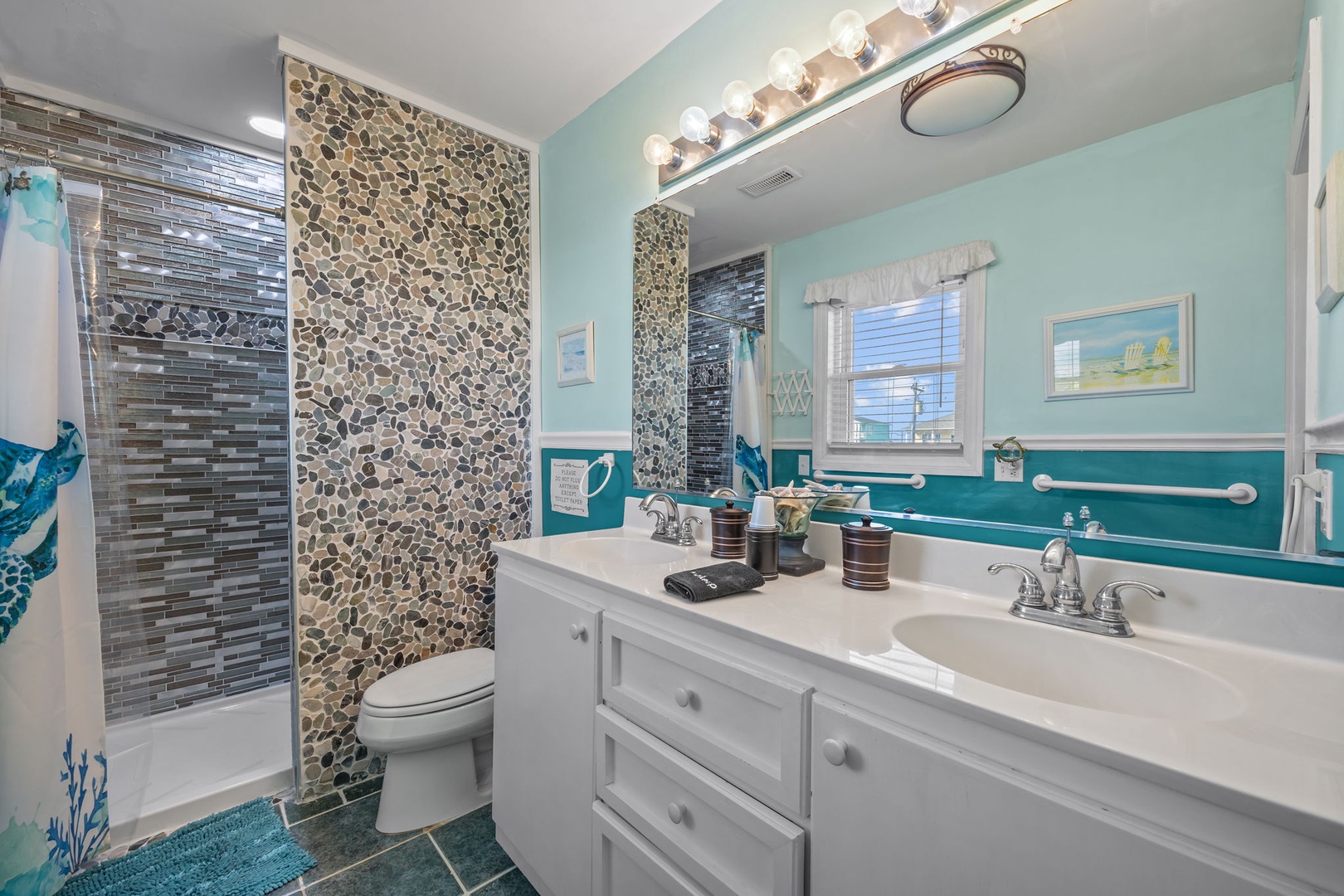Refresh in your coastal-inspired bathroom with stone accent tiles, dual vanities, and spa-like details that make your morning routine feel luxurious.