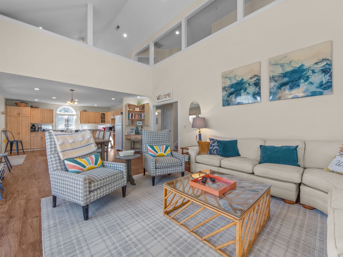 Relax in your bright, airy living space featuring soaring ceilings and cozy seating where you'll unwind after exploring.