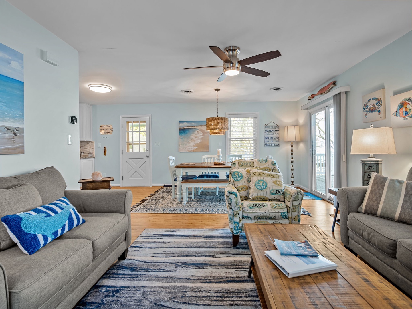 Relax in your coastal-themed living room with ocean-inspired décor, comfortable seating, and calming blue hues creating the perfect seaside retreat.