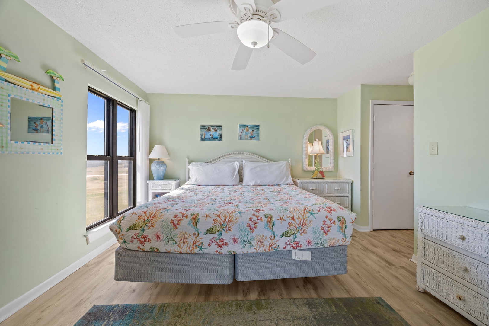 Drift off to sleep in your coastal-themed bedroom with soft linens and gentle sea breezes from your ceiling fan.