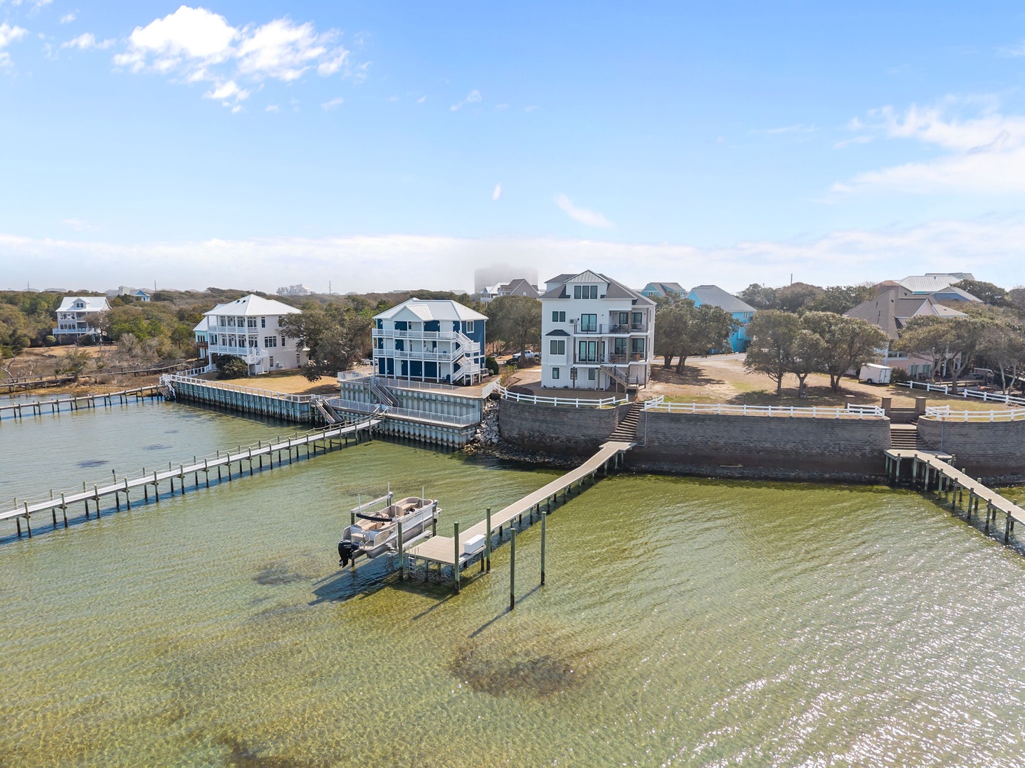 Stunning waterfront property with private pier and dock access in a charming coastal community.
