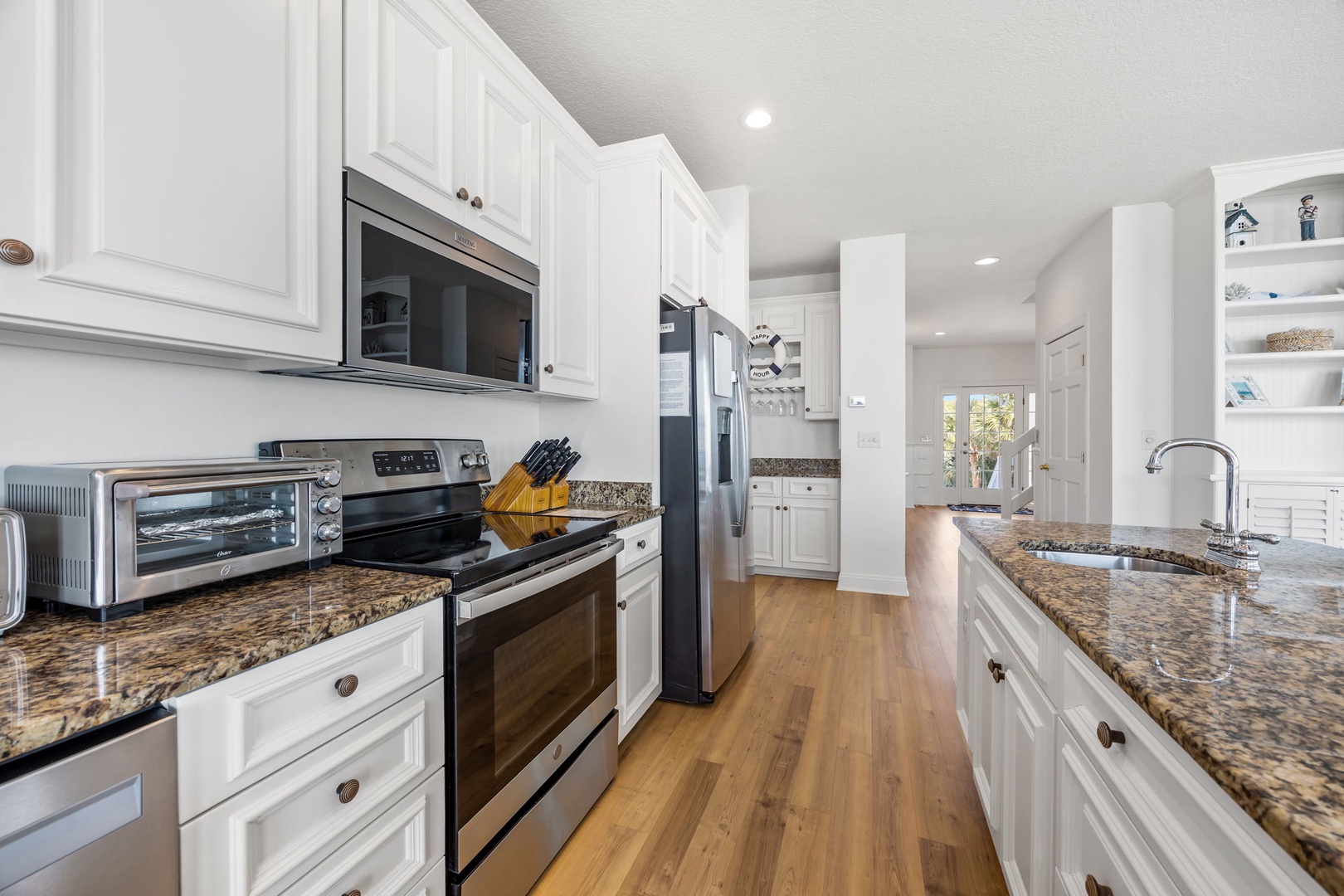 Your fully equipped kitchen features granite countertops, stainless steel appliances, and all the essentials for preparing memorable meals during your stay.
