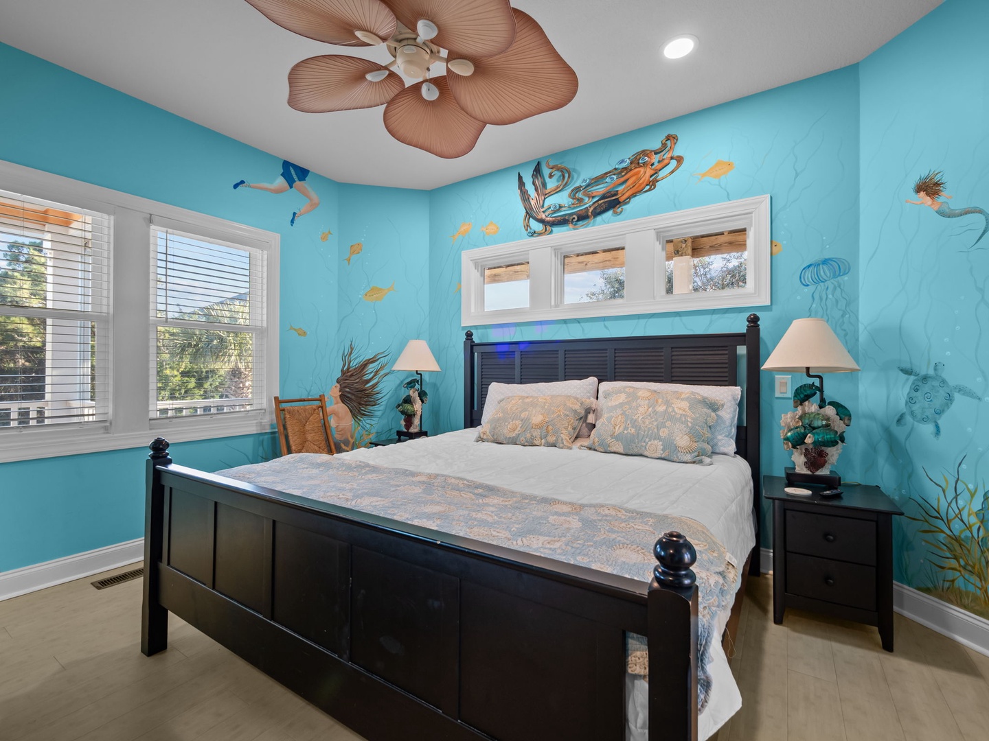 Drift off to sleep in this ocean-themed bedroom where sea life murals and tropical breezes create your personal underwater paradise.