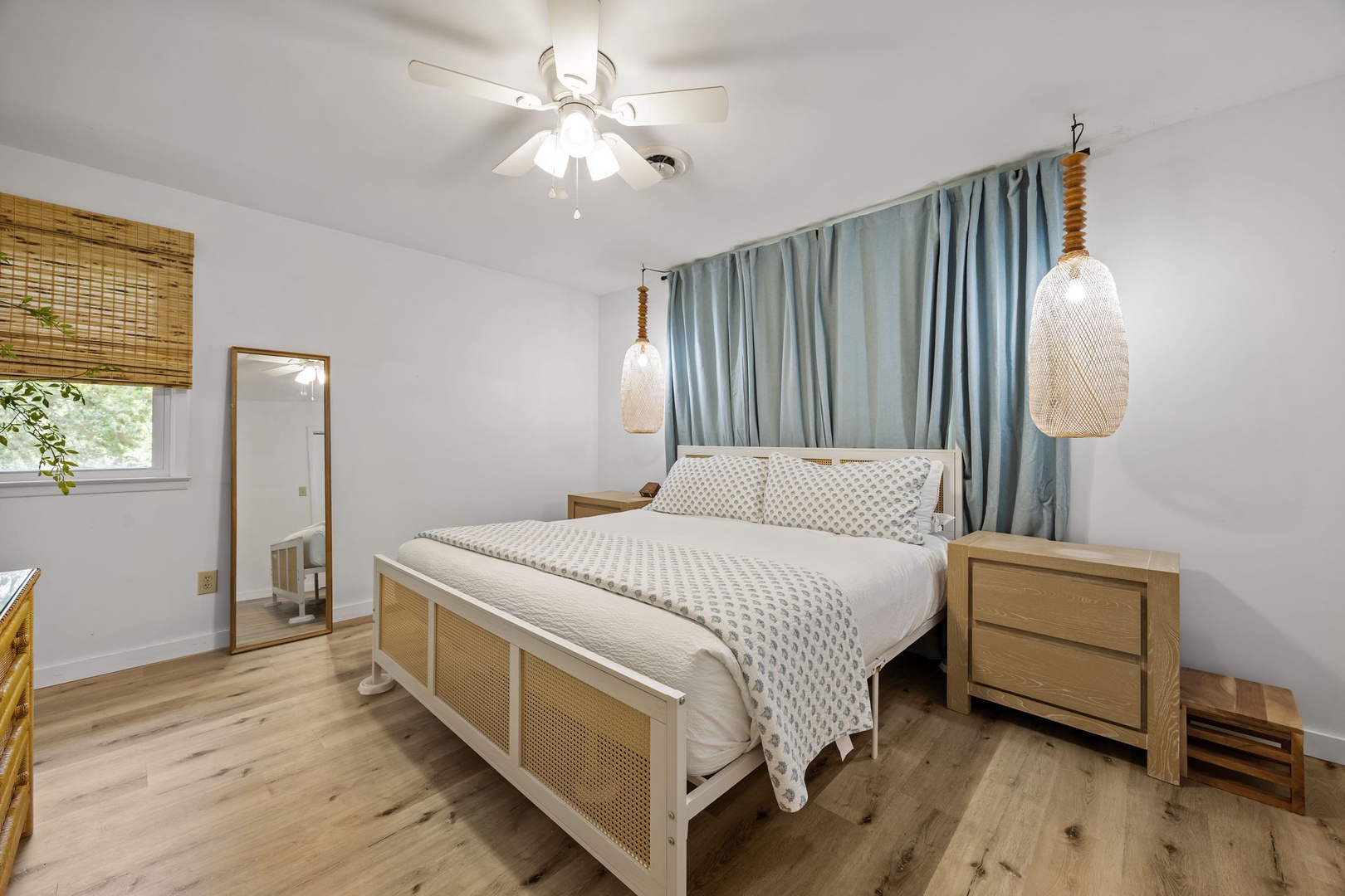 Drift off in your serene bedroom featuring a cozy bed, natural textures, and calming blue accents for peaceful nights.