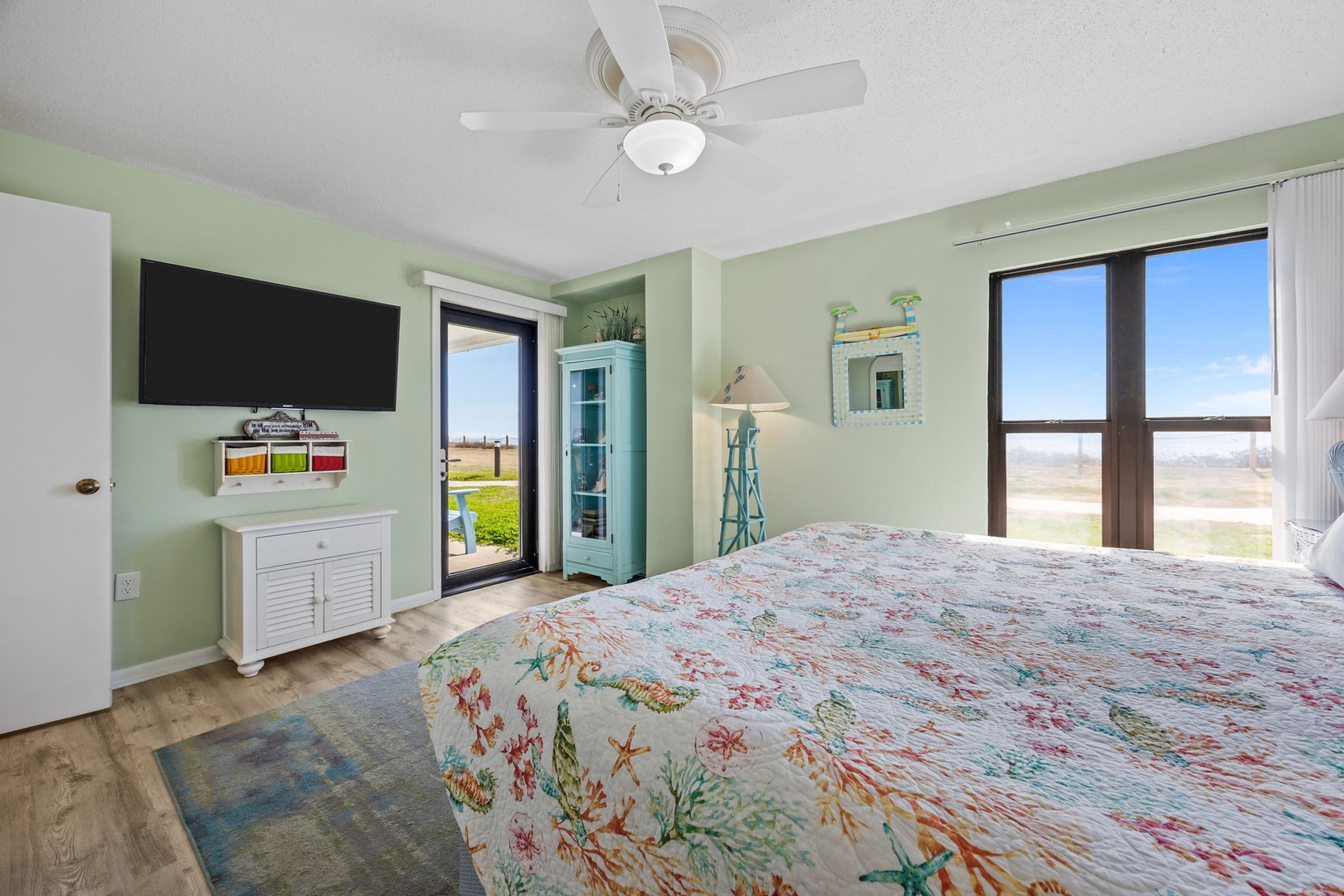 Wake up to ocean views in your peaceful bedroom, where soft coastal colors and comfortable furnishings create the perfect seaside retreat.