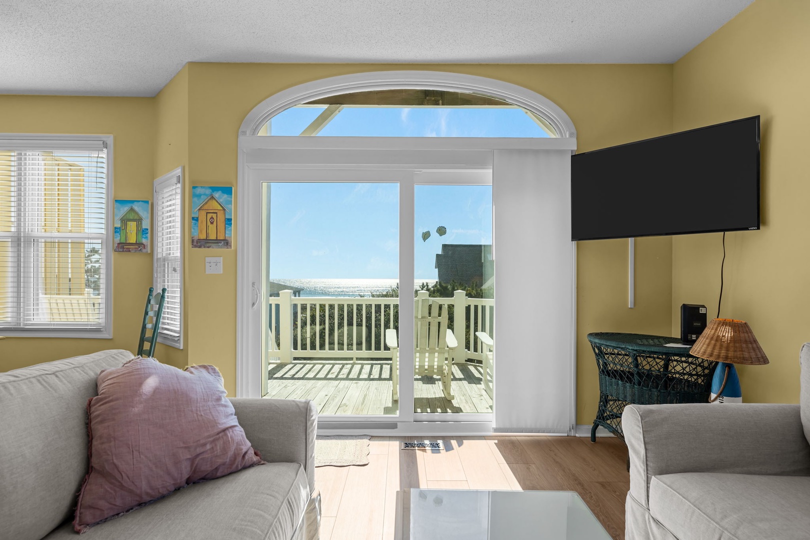 Relax in your bright living space with coastal art and step onto your private balcony for sunny ocean breezes.