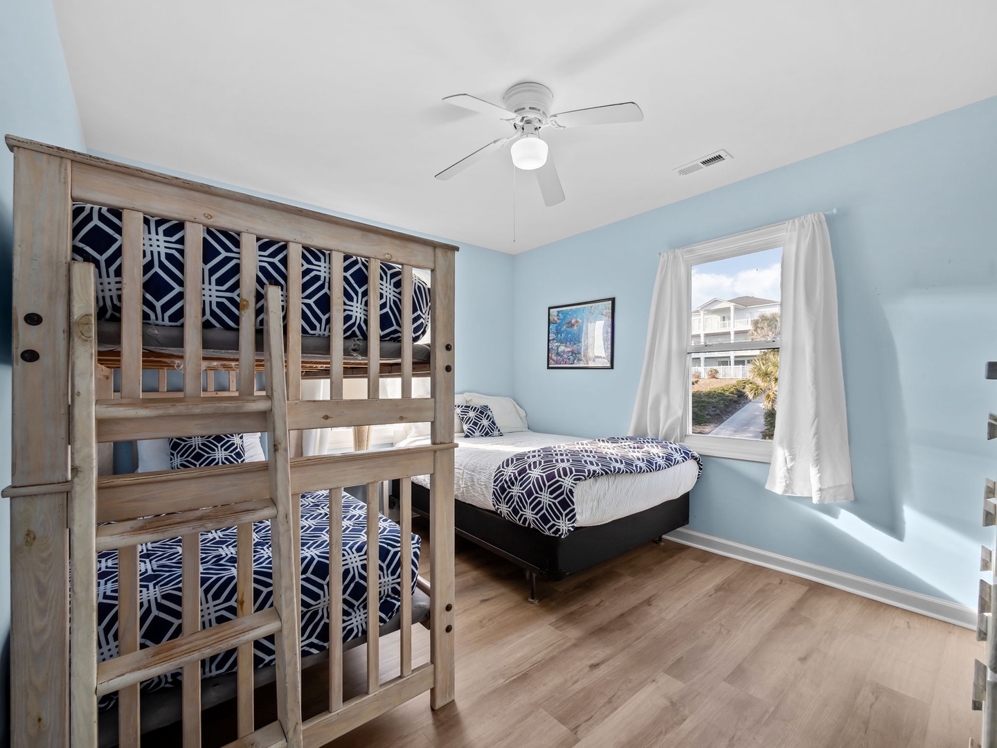 Twin bunk bed accompanied with a separate double bed.