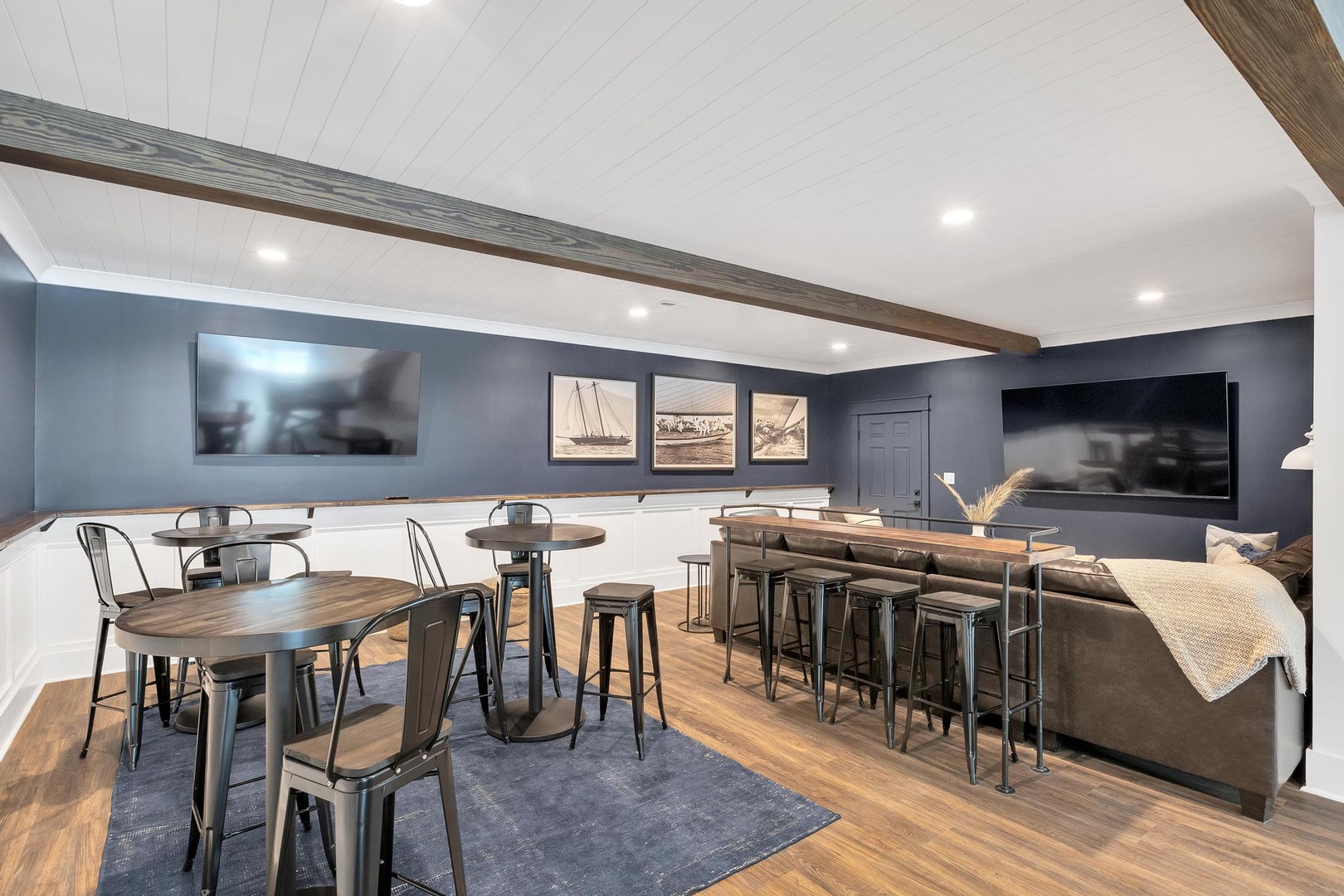 Your private entertainment haven features a stylish bar with seating, game tables for lively gatherings, and dual TVs for movie nights or catching the big game together.