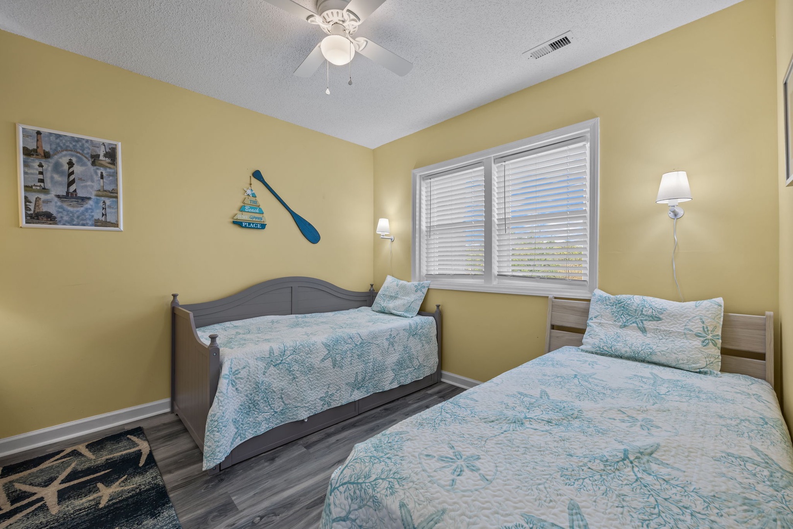 Drift off to sleep in your coastal-themed bedroom with twin beds and cheerful nautical touches that capture beach vibes.