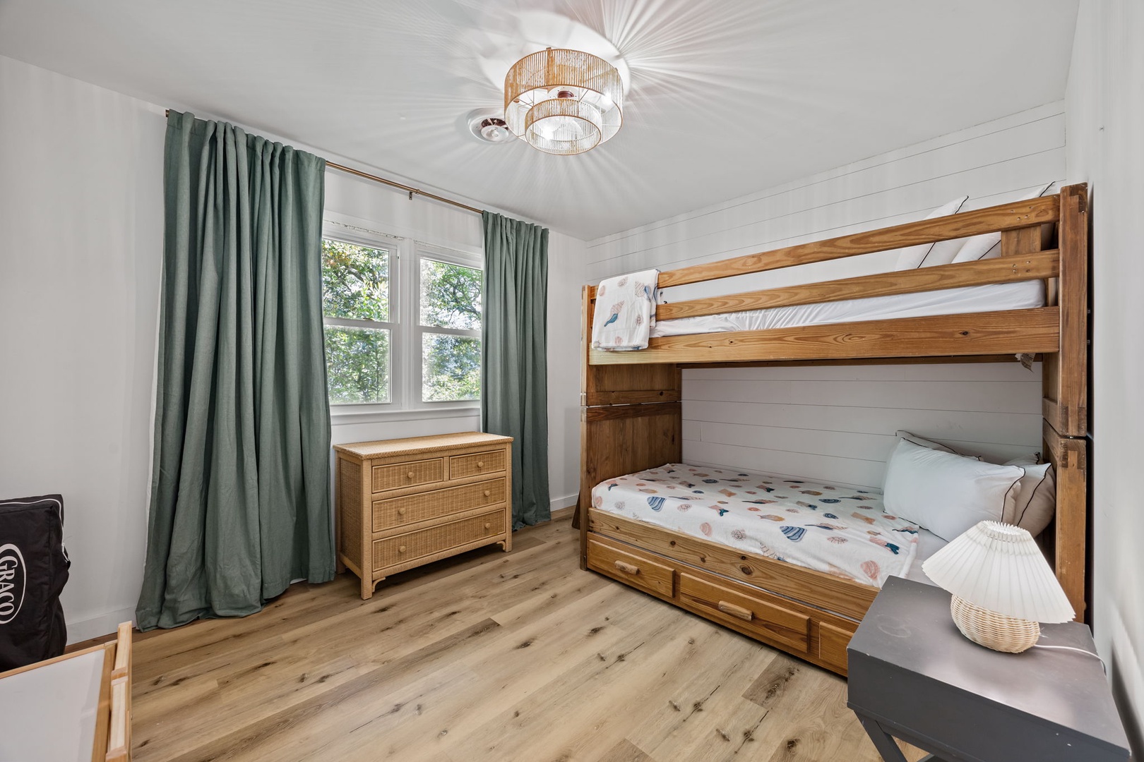 Your kids will love this cheerful bedroom with sturdy wooden bunk beds and plenty of natural light.
