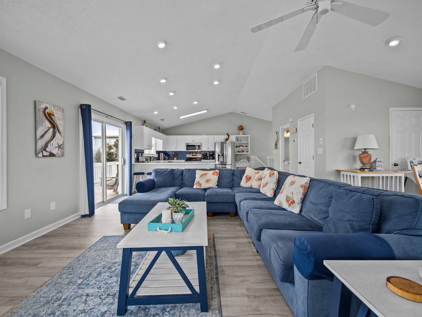 Sink into this spacious sectional and enjoy the coastal-inspired decor, vaulted ceilings, and open-concept design connecting your living space to a fully equipped kitchen.