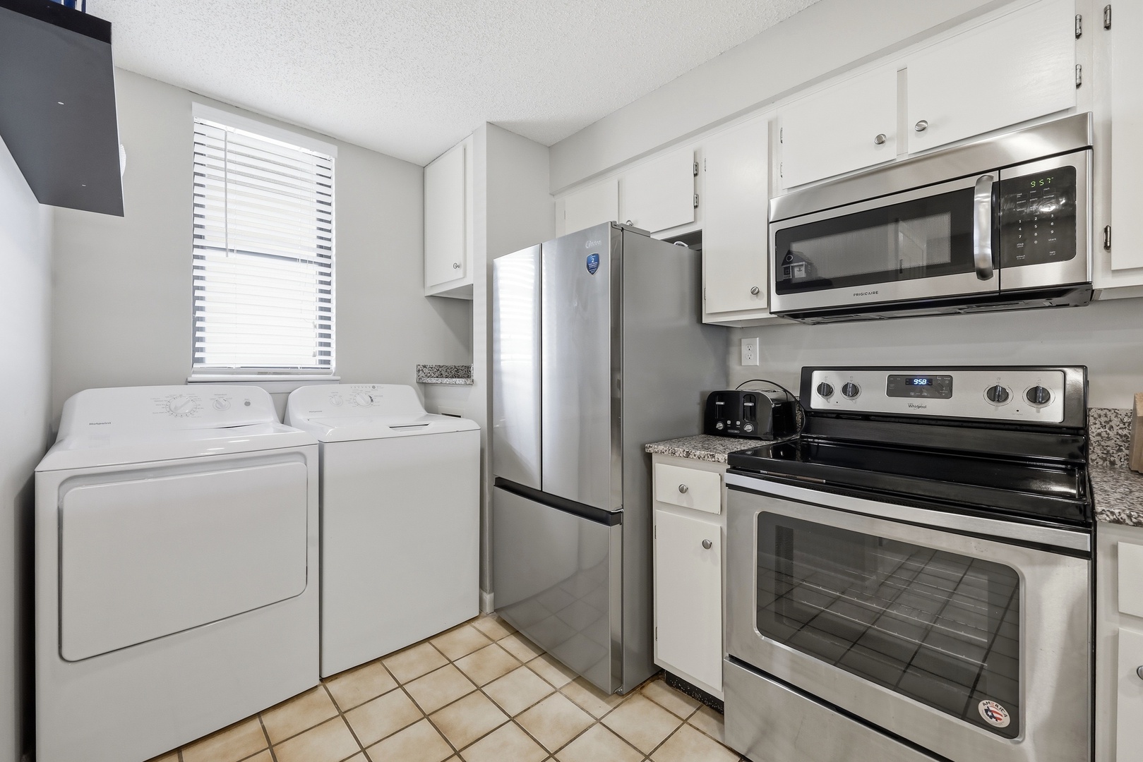 Your kitchen includes full-size modern appliances—fridge, stove, microwave—and in-unit washer and dryer, so you can pack light and cook comfortably during your stay.