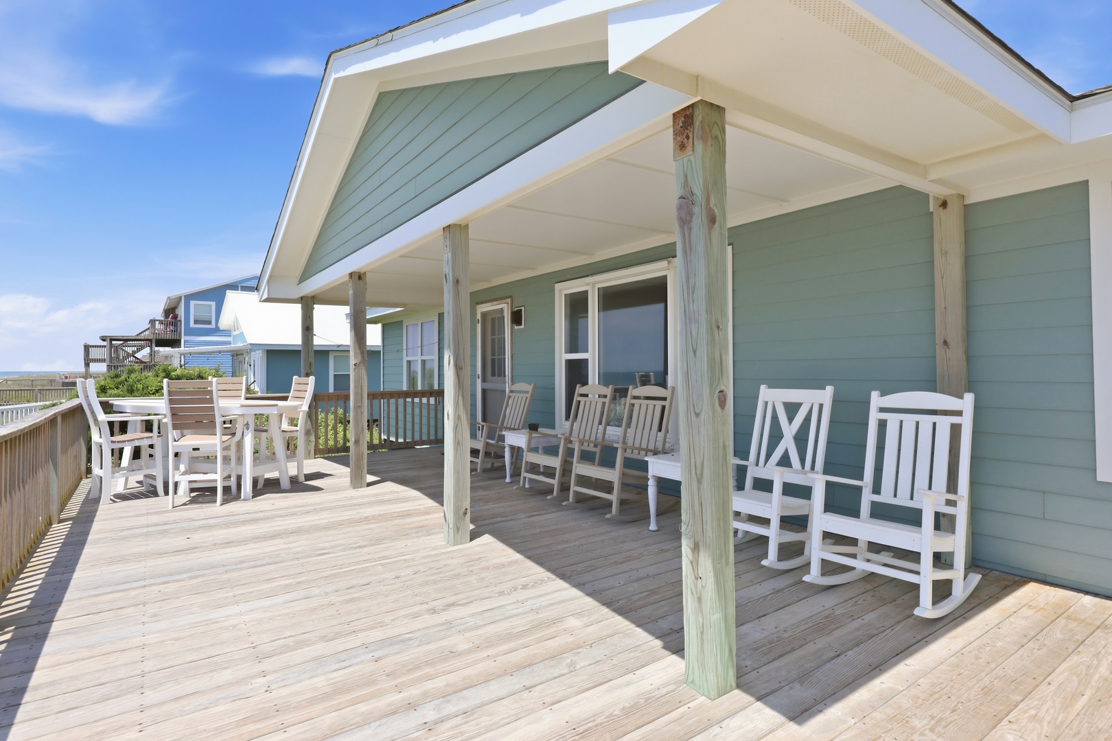 Your spacious covered deck welcomes you with plenty of seating for relaxing and dining outdoors, all with easy ocean access just steps away.