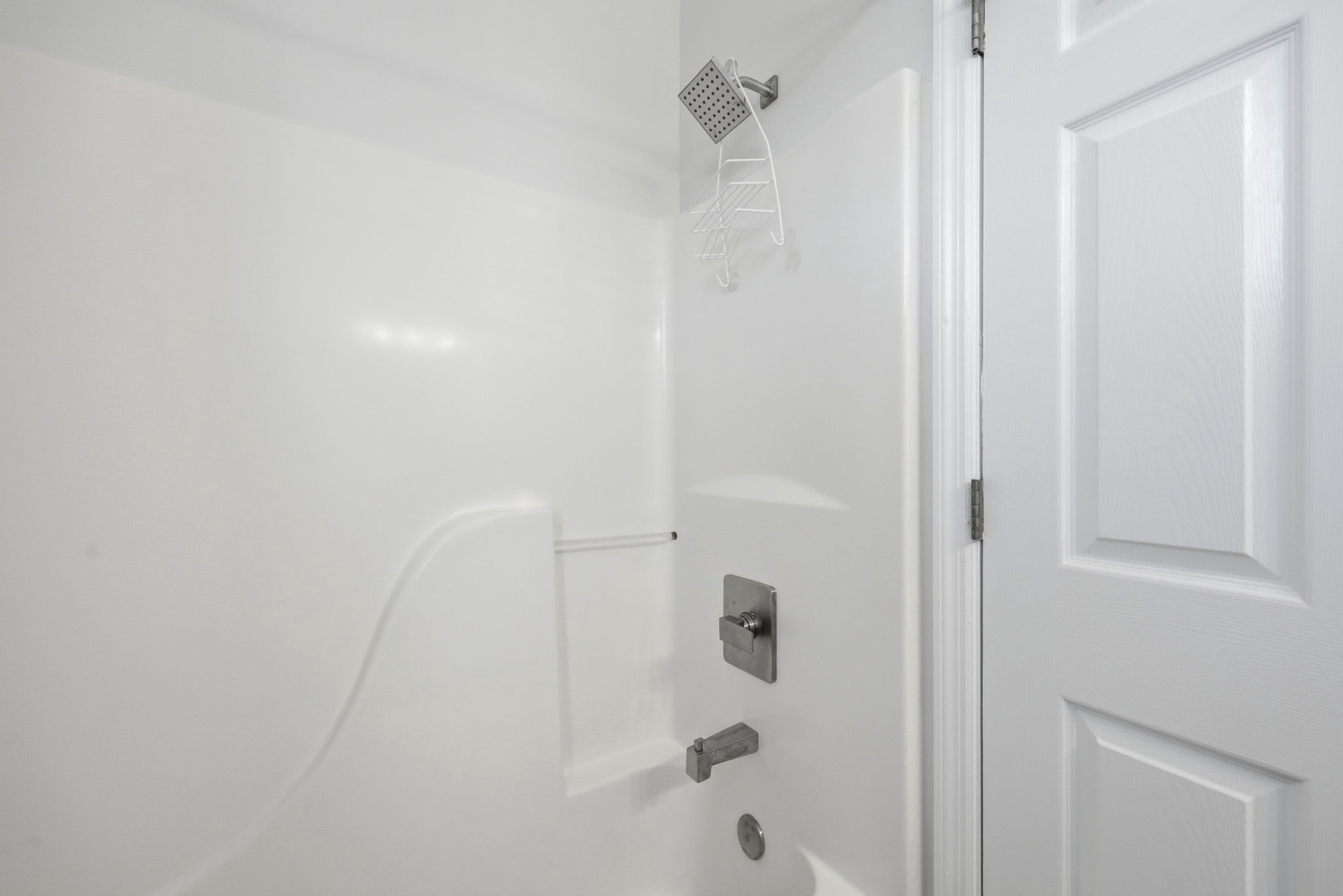 Your private bathroom features a spotless tub-shower combo with modern fixtures, freshly cleaned and ready for your stay.