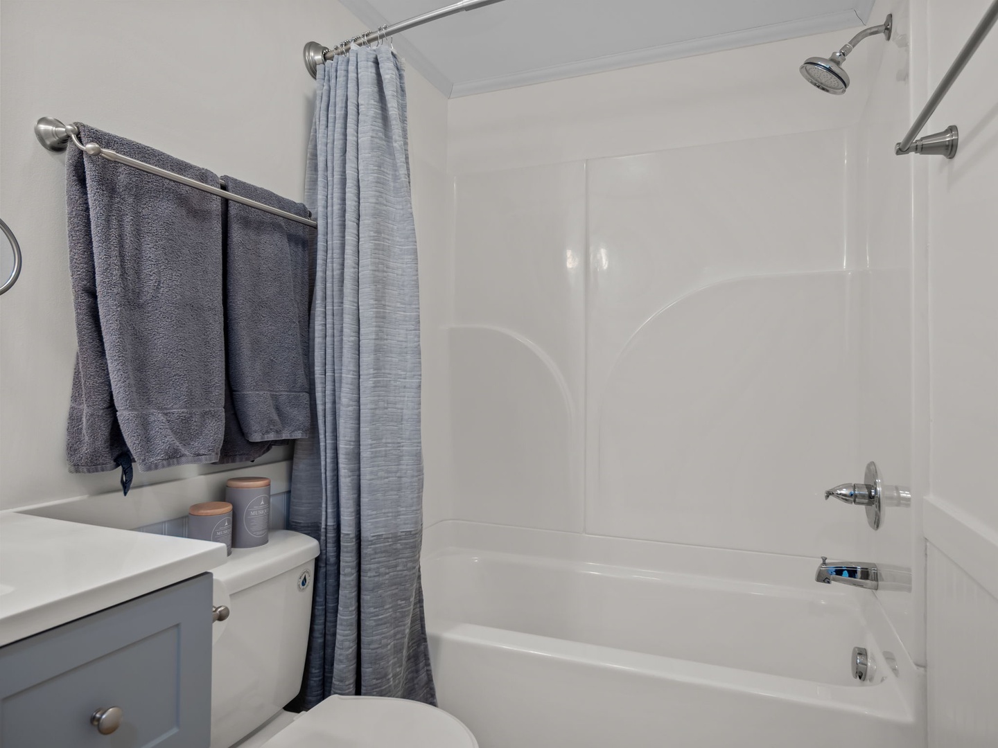 Refresh after your adventures in this clean, modern bathroom with plush towels and a spacious tub-shower combo.