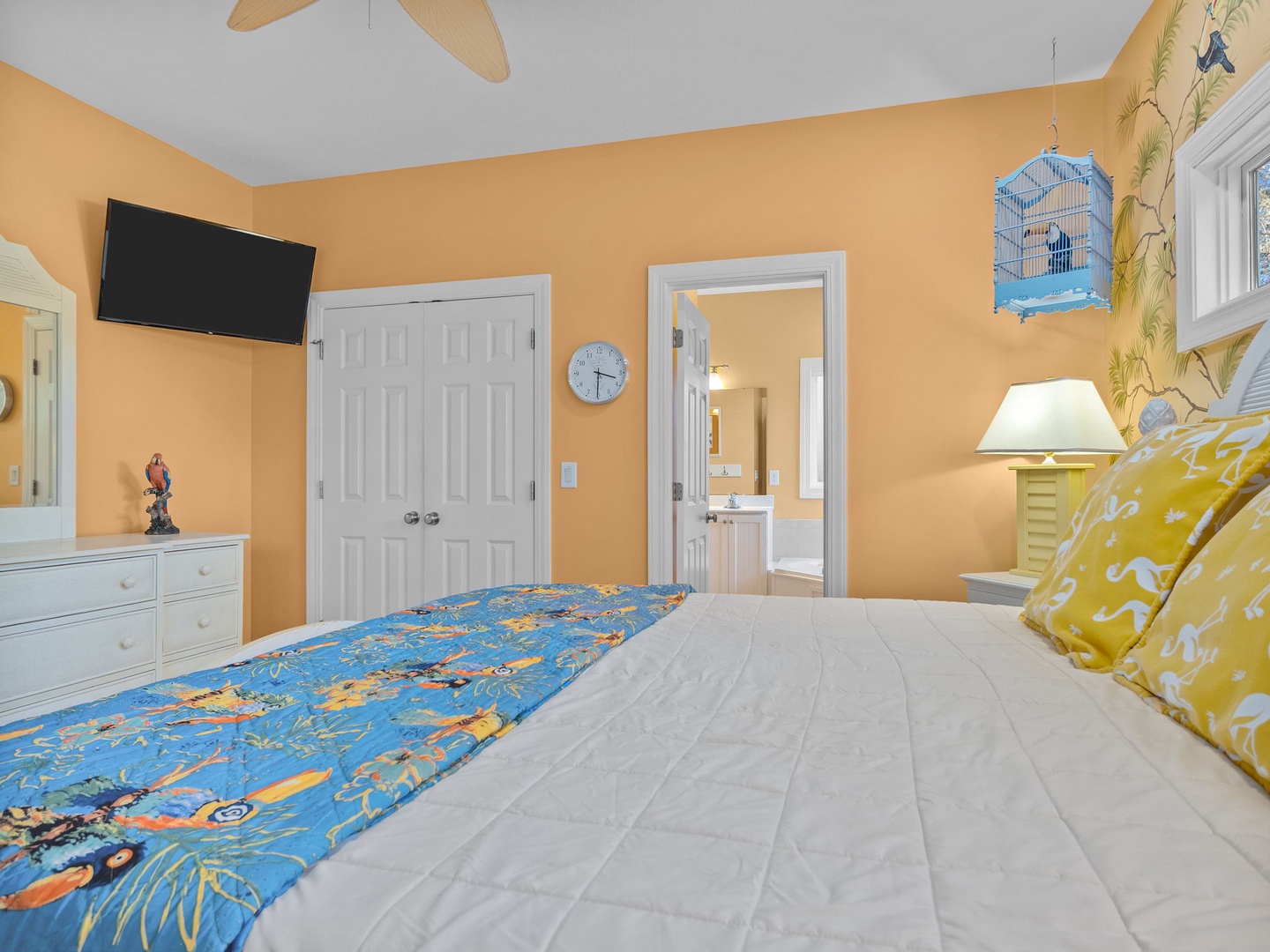 Drift off in this cheerful bedroom with tropical touches, your own TV, and an ensuite bathroom just steps away.