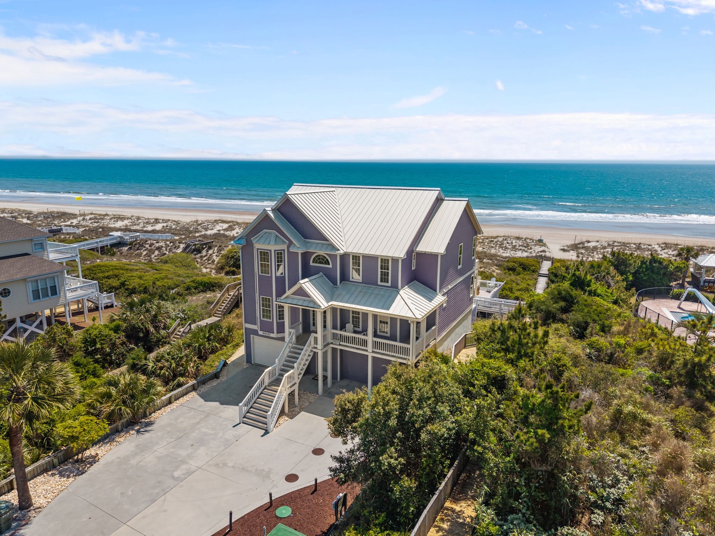 This stunning beach house sits perfectly positioned between ocean and dunes, offering direct beach access and breathtaking coastal views from every angle.