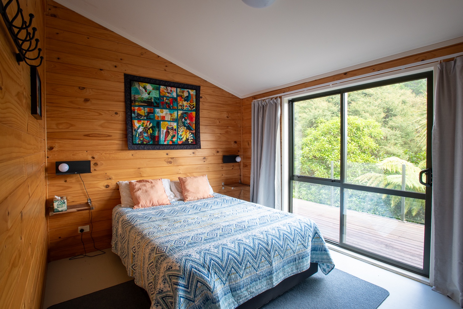 Corner queen bedroom has views of the Sounds from the bed and a slider that goes directly onto the deck