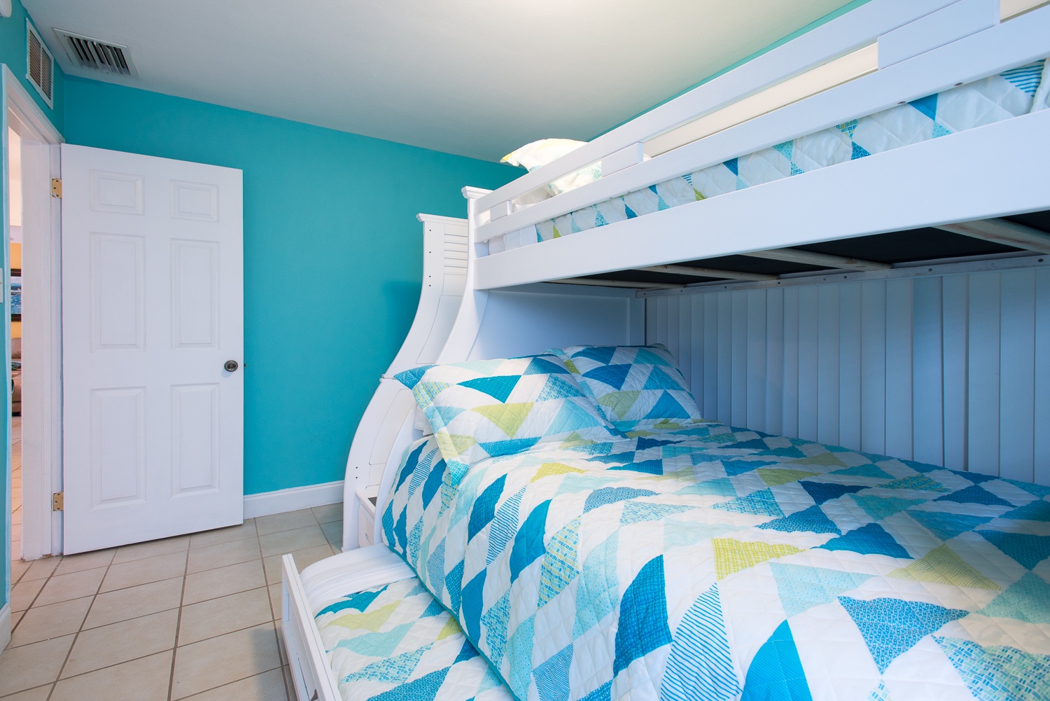 This bedroom has a full, a twin bunk and a pull out twin trundle bed