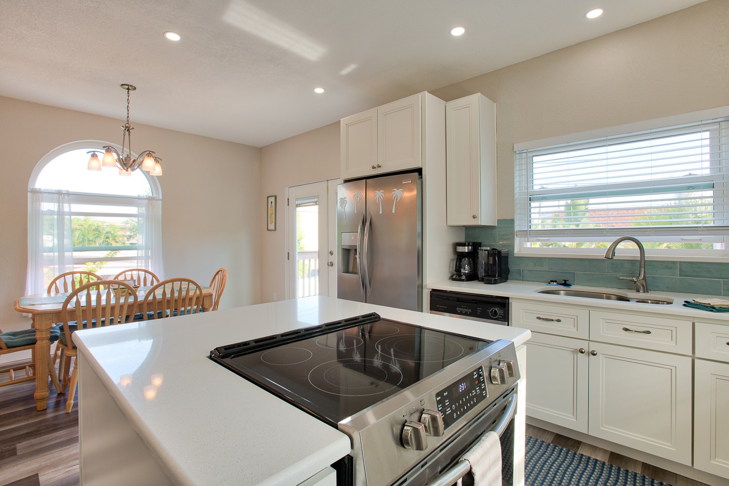 Stovetop and oven are located in the kitchen island