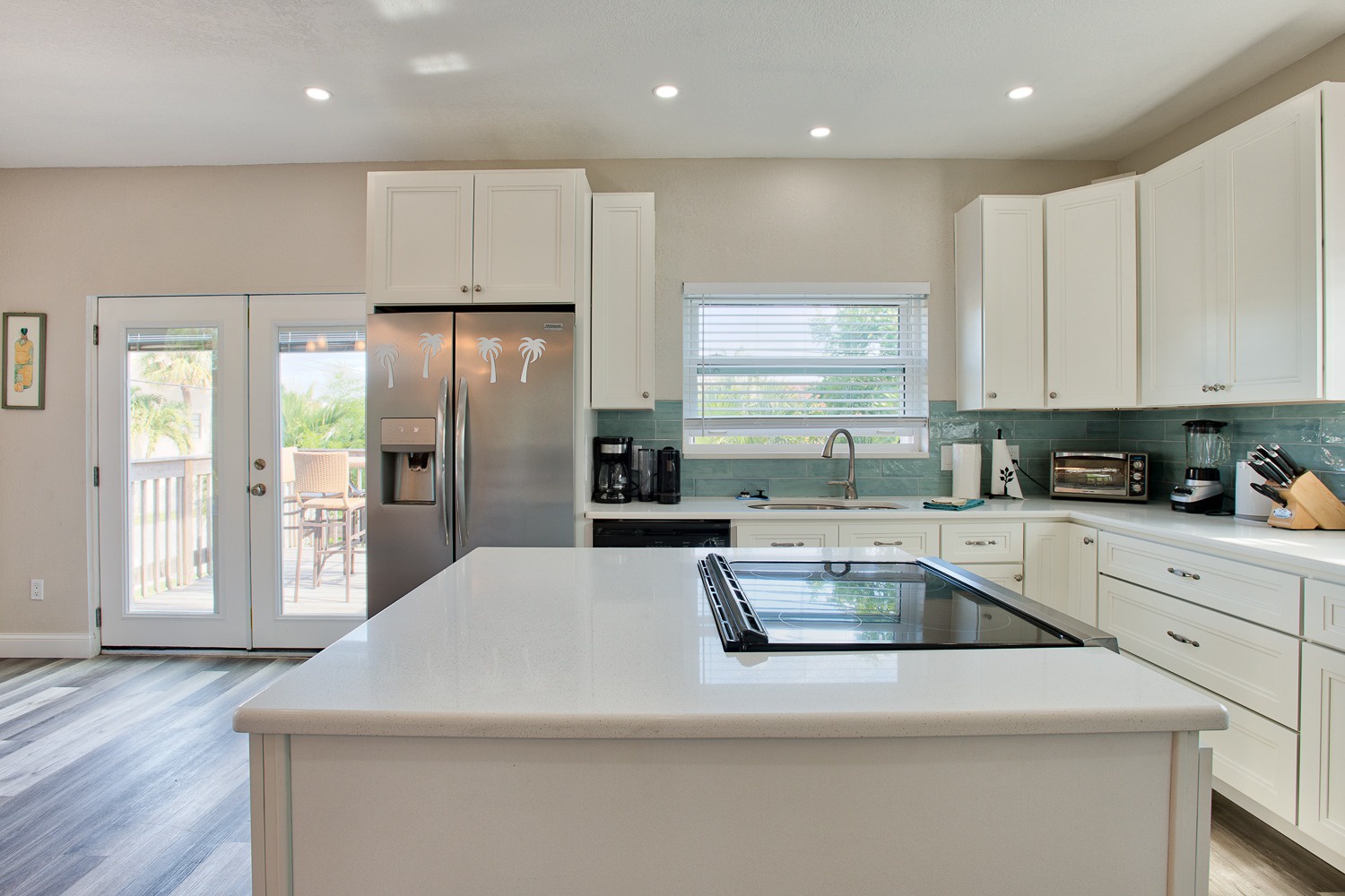 Large kitchen, large island, French doors to the deck, plenty of counter space