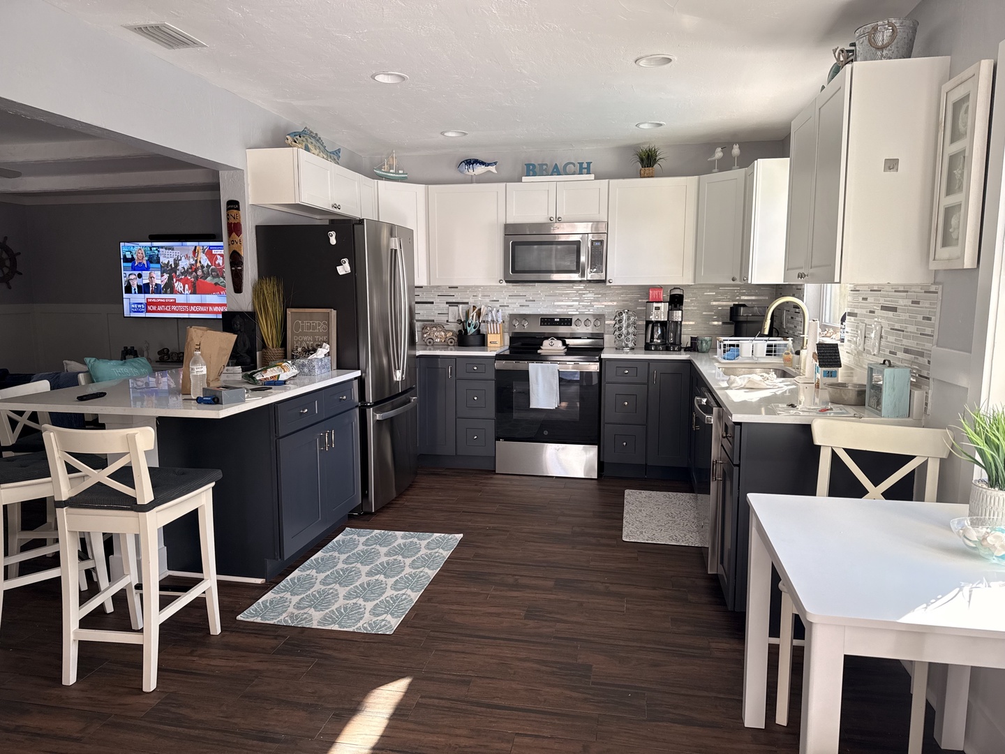 Cook memorable meals in your spacious kitchen with granite counters, stainless appliances, and coastal charm throughout.