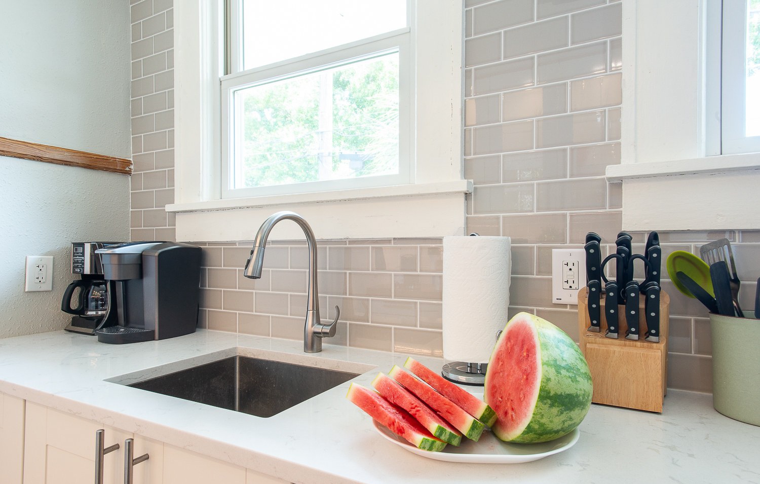 Sink side has Cesarstone counters