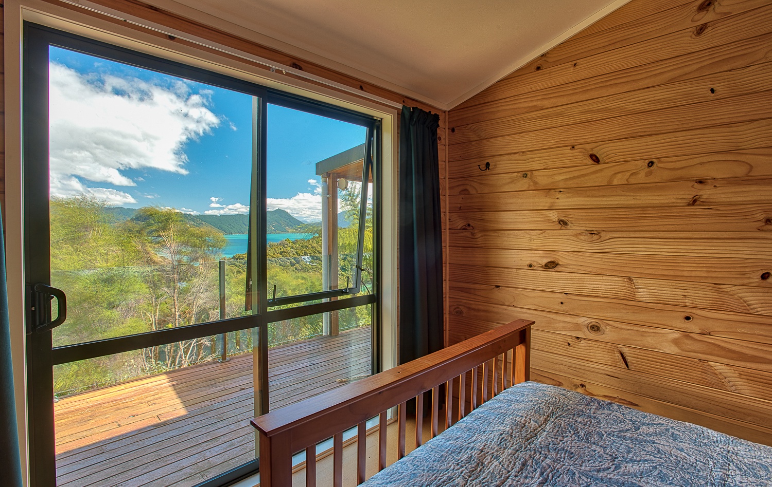 Full/double bed in this room with access to deck and views