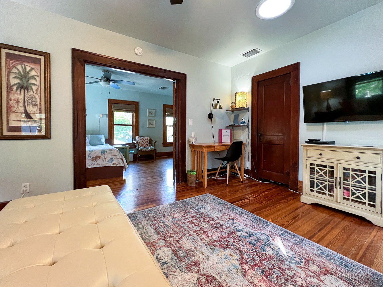 Living room with view into bedroom