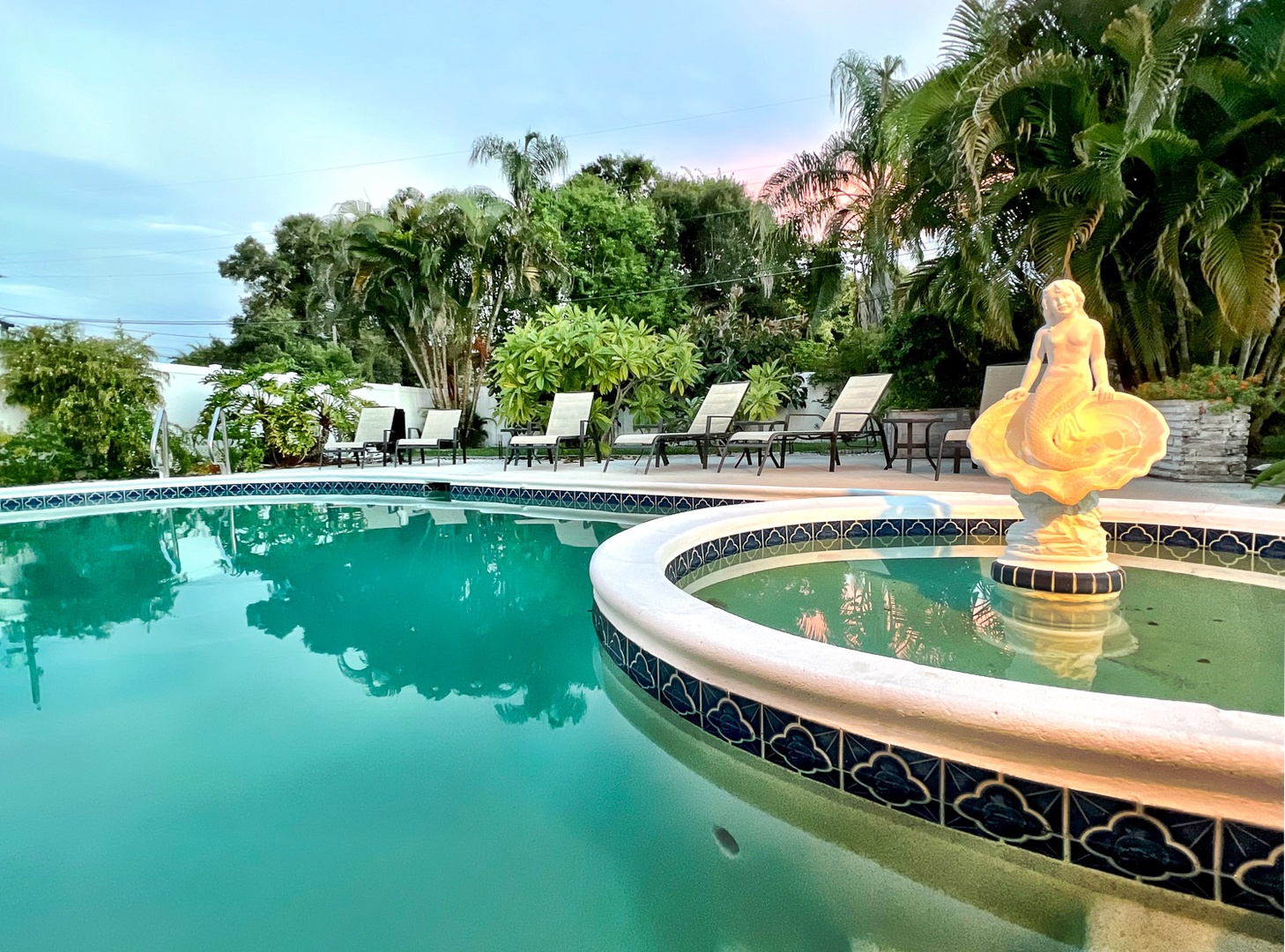 Pool and fountain at dusk