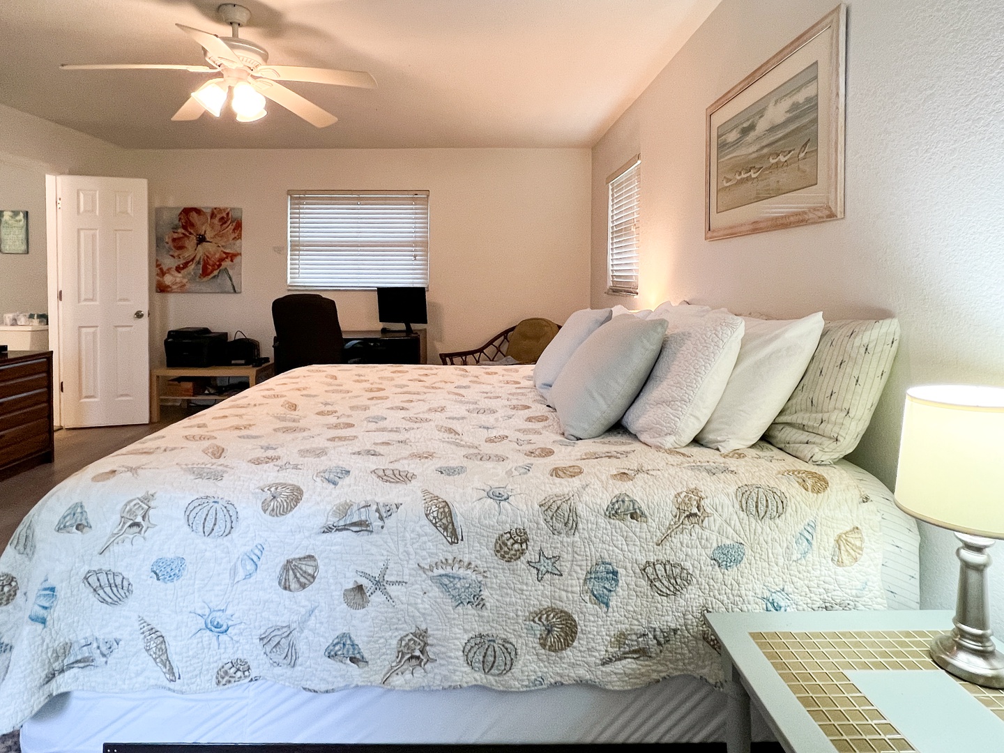 King bed in large master bedroom - this room includes a desk and office chair