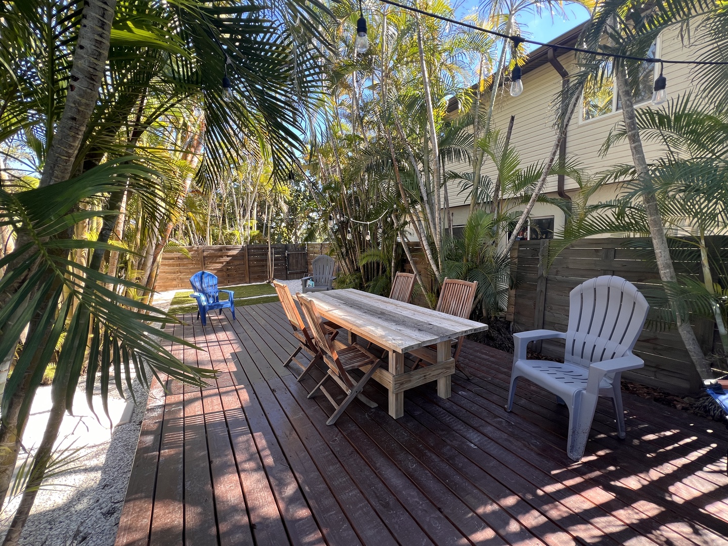 Relax on your private tropical deck surrounded by swaying palms, where morning coffee and sunset dinners become unforgettable moments.