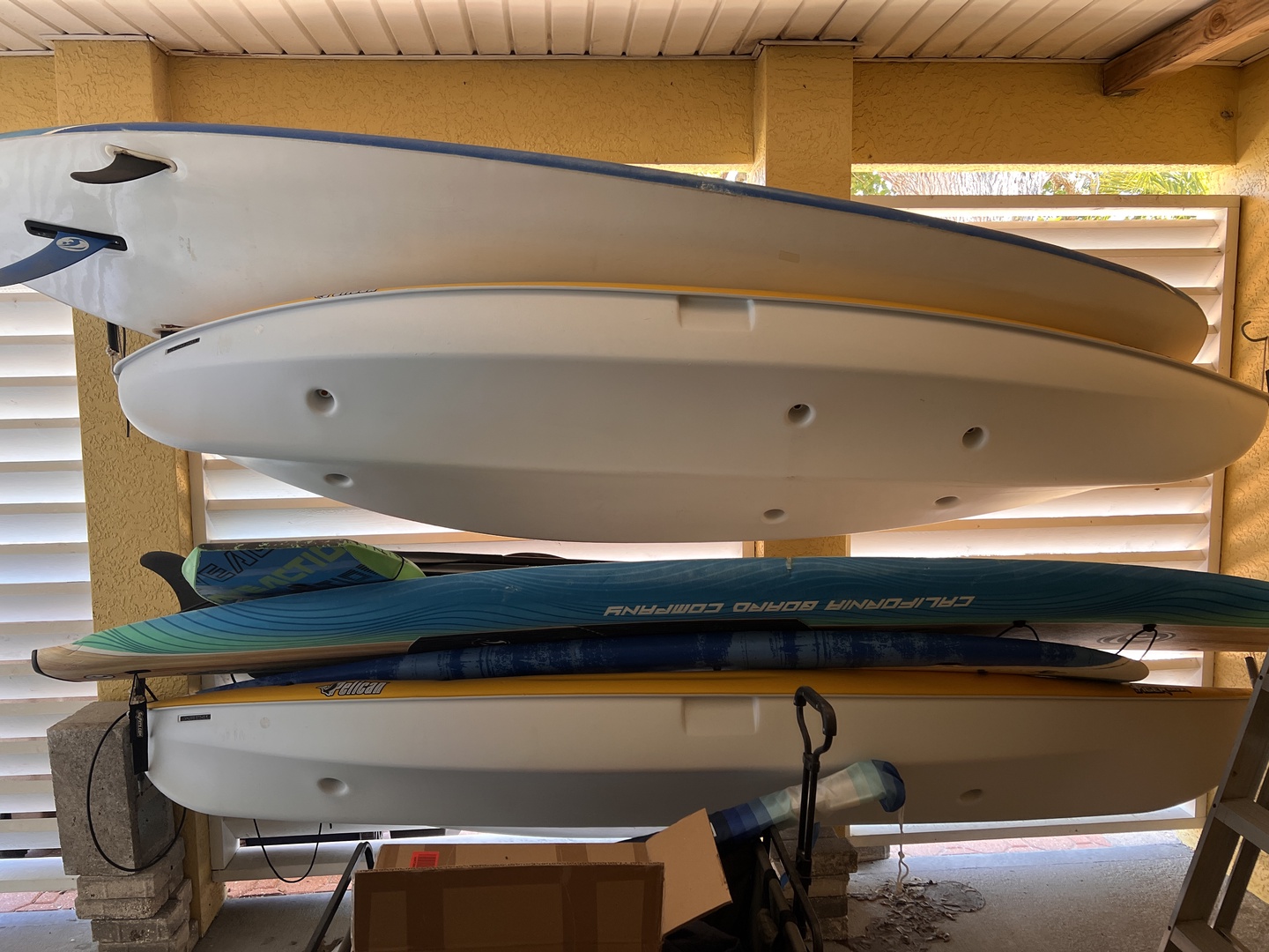 Your surfboard storage awaits! Multiple boards ready for your beach adventures.