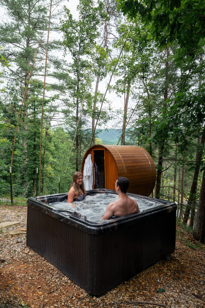 Hot tub and Sauna nested in the woods with couples