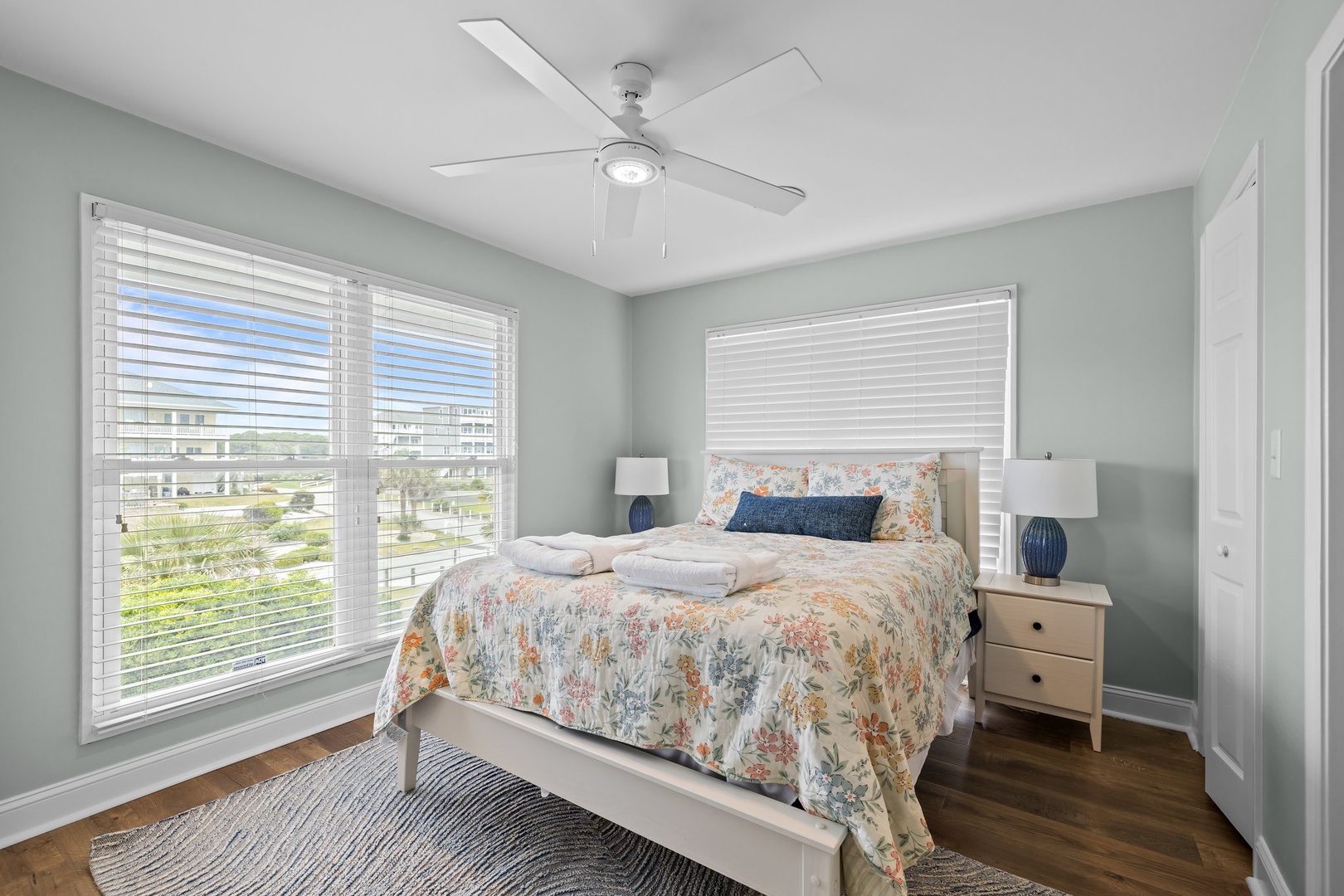 Drift off peacefully in your serene bedroom, where soft coastal colors and fresh linens create the perfect retreat after sunny beach days.